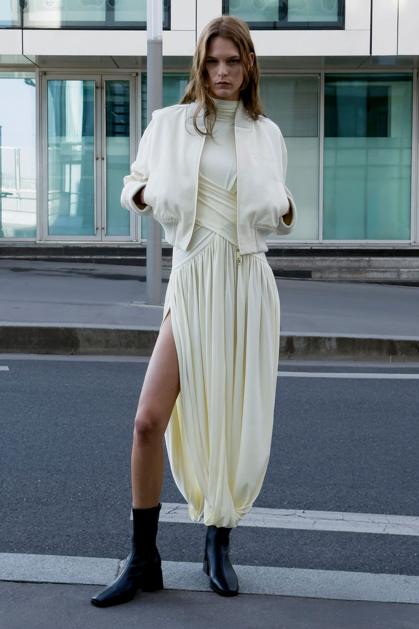 beige silk sleeveless high-neck fitted draped flowing dress