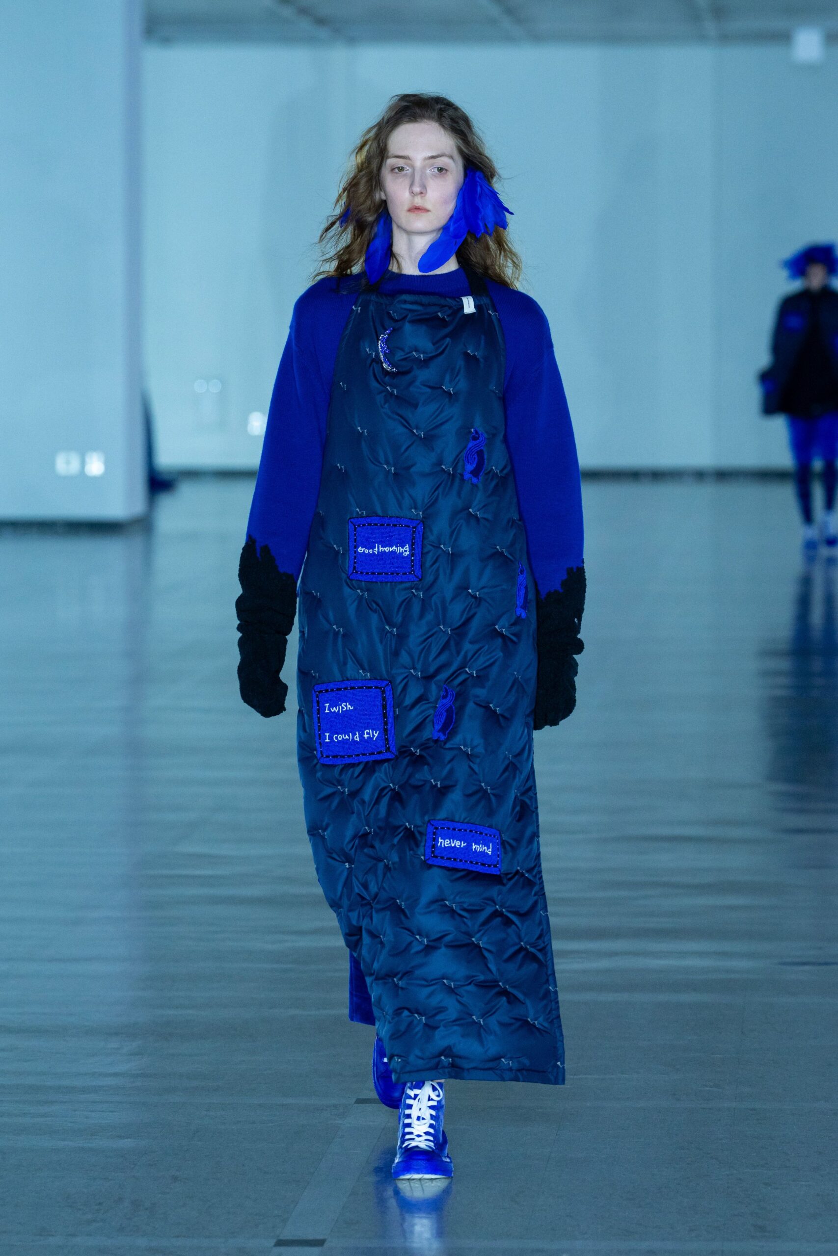 blue padded coat with shoes and hat