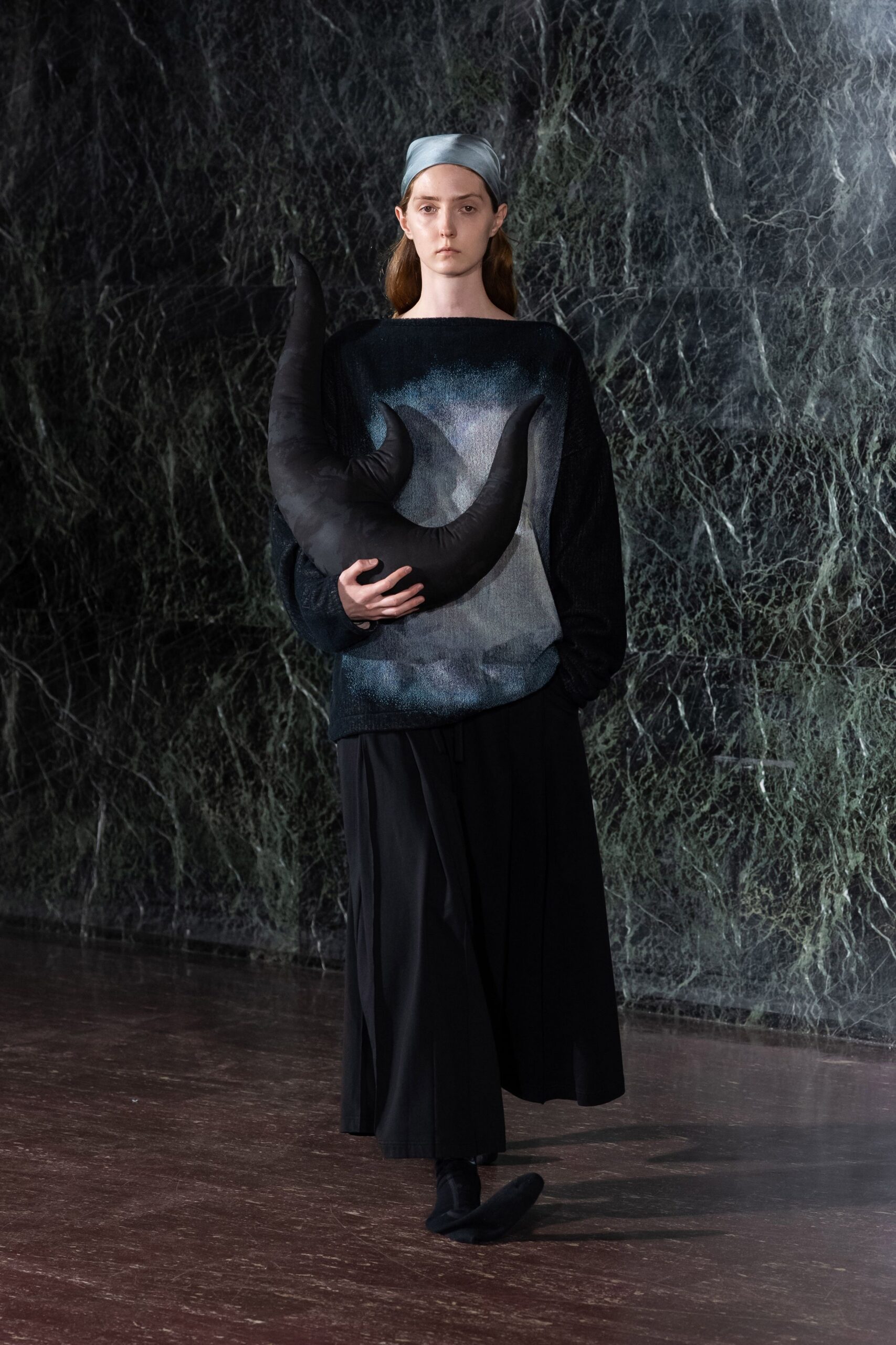 relaxed black top with pleated skirt