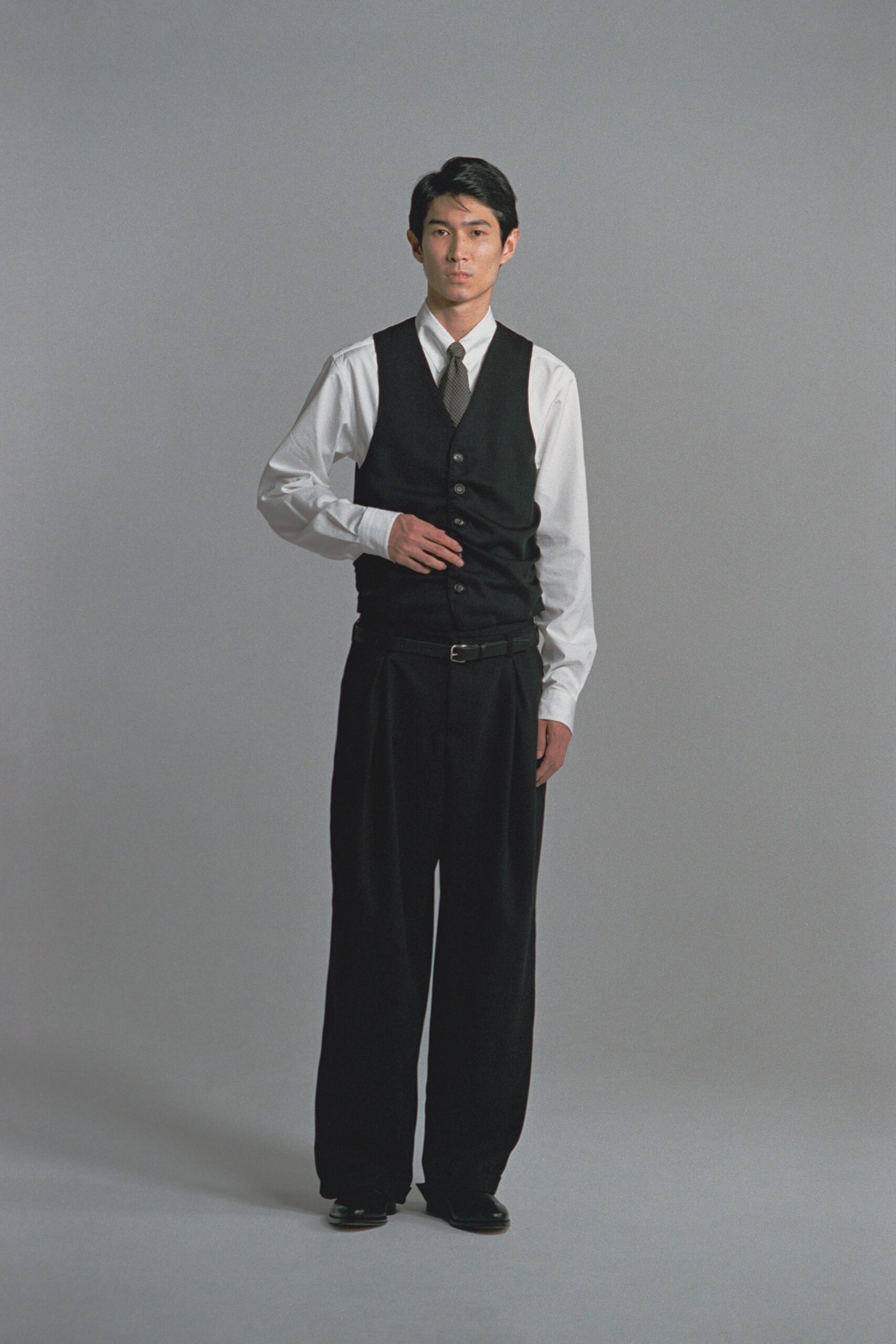 black vest white shirt relaxed pants