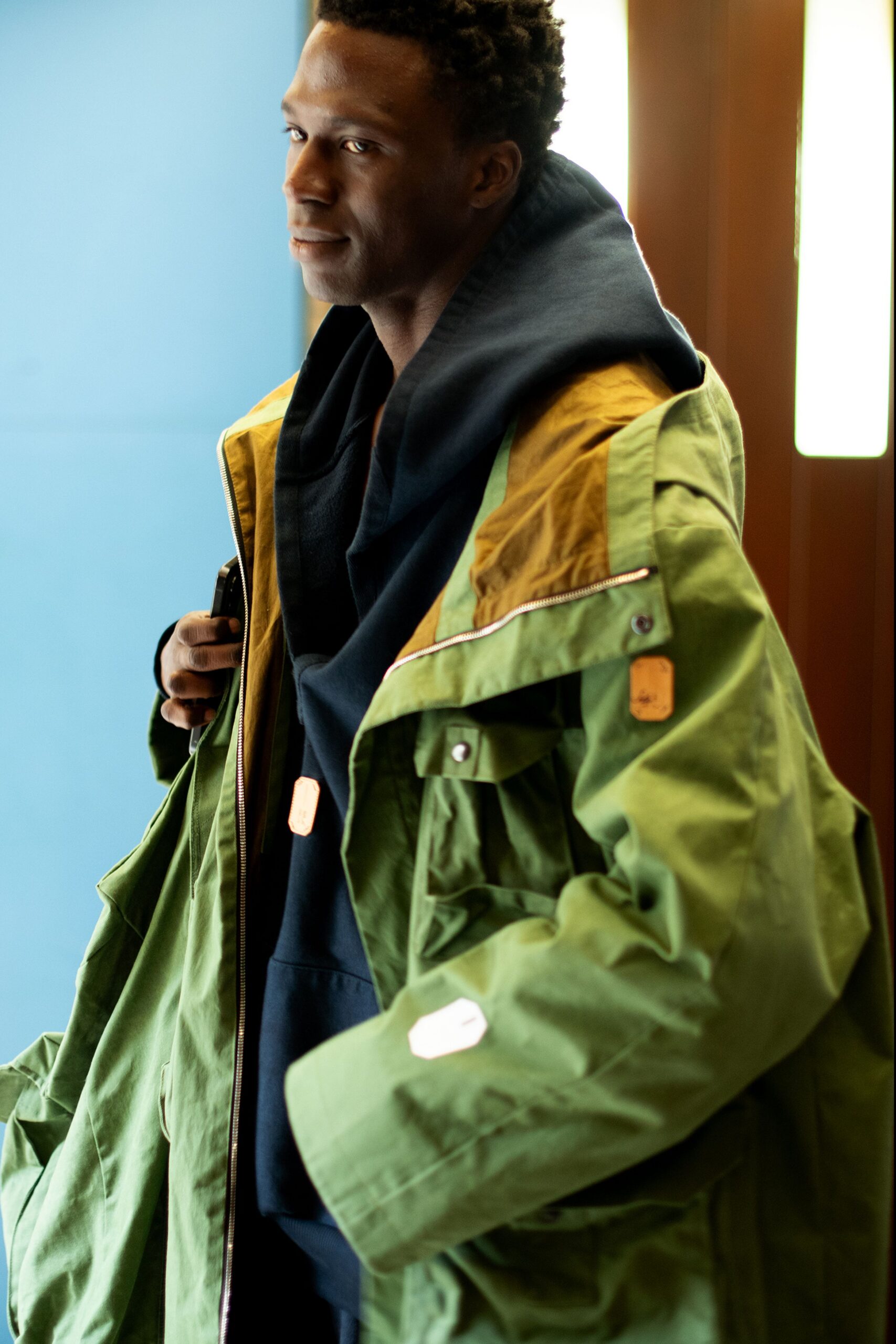 green jacket with black hoodie