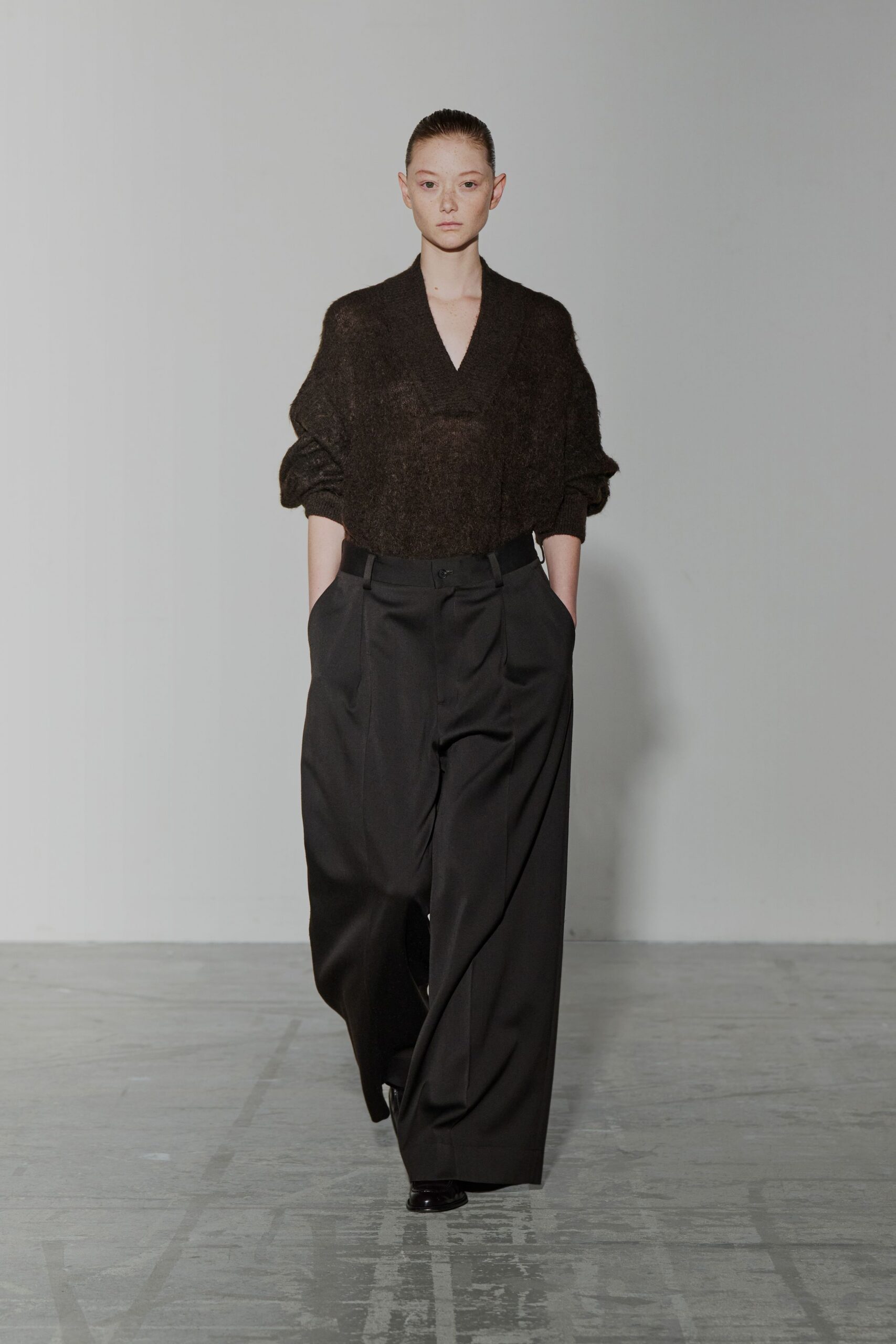 brown wool relaxed top with black pants