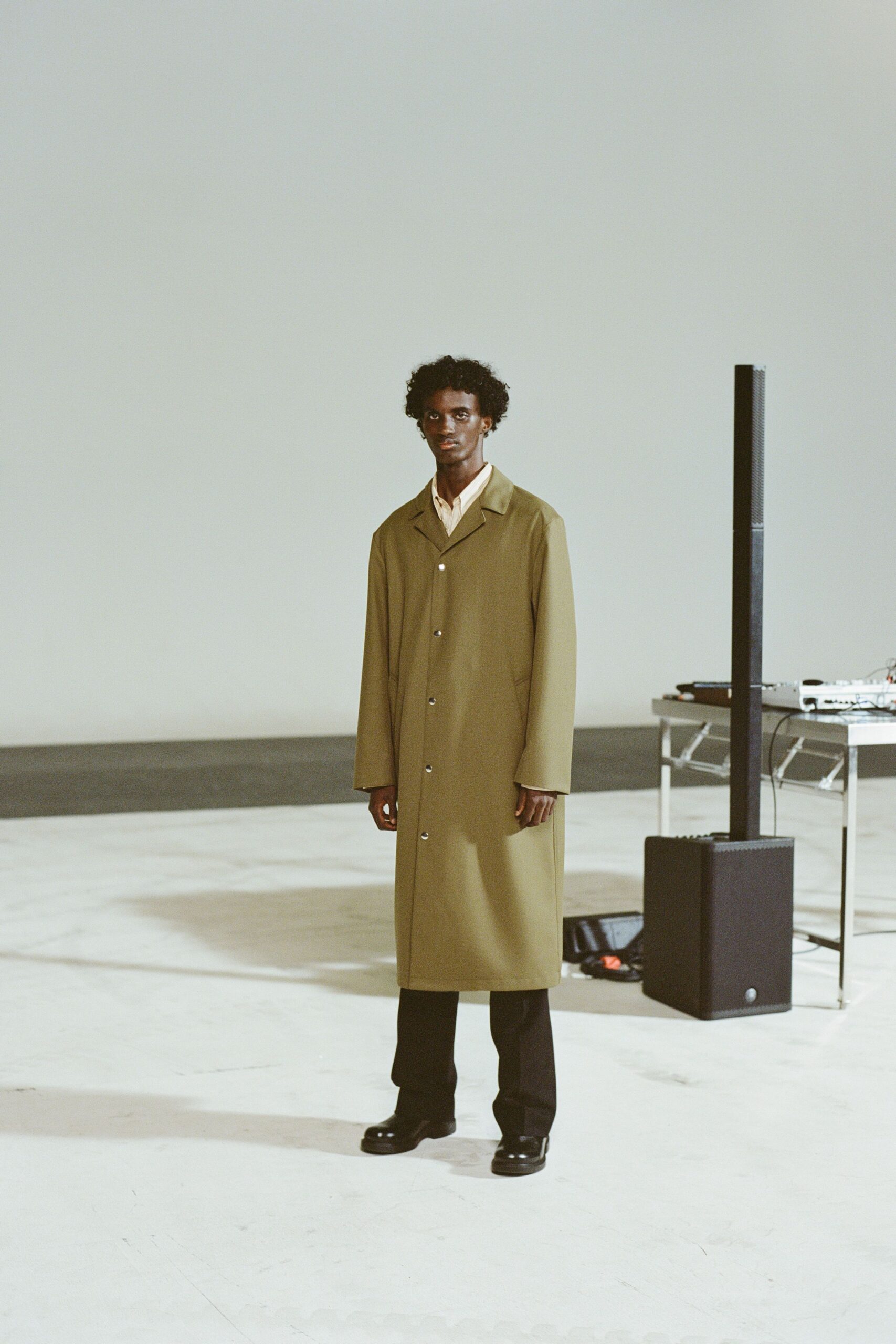 green vinyl long-sleeve collared relaxed buttoned midi coat