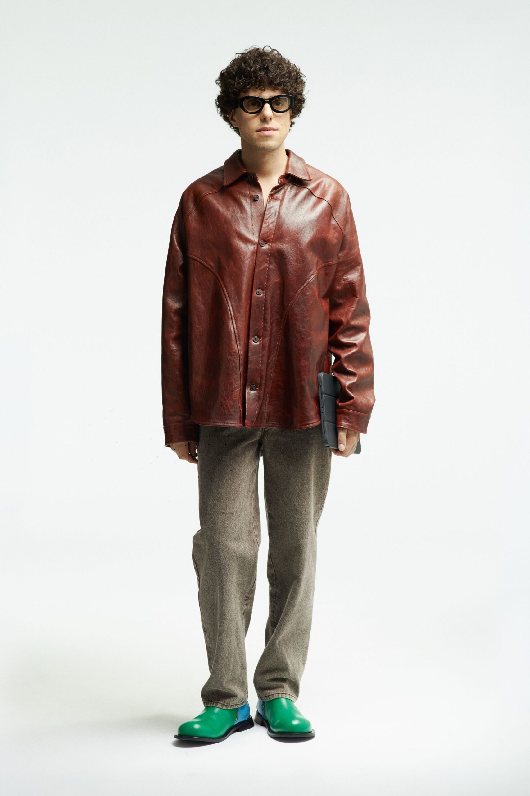 brown leather shirt with gray pants