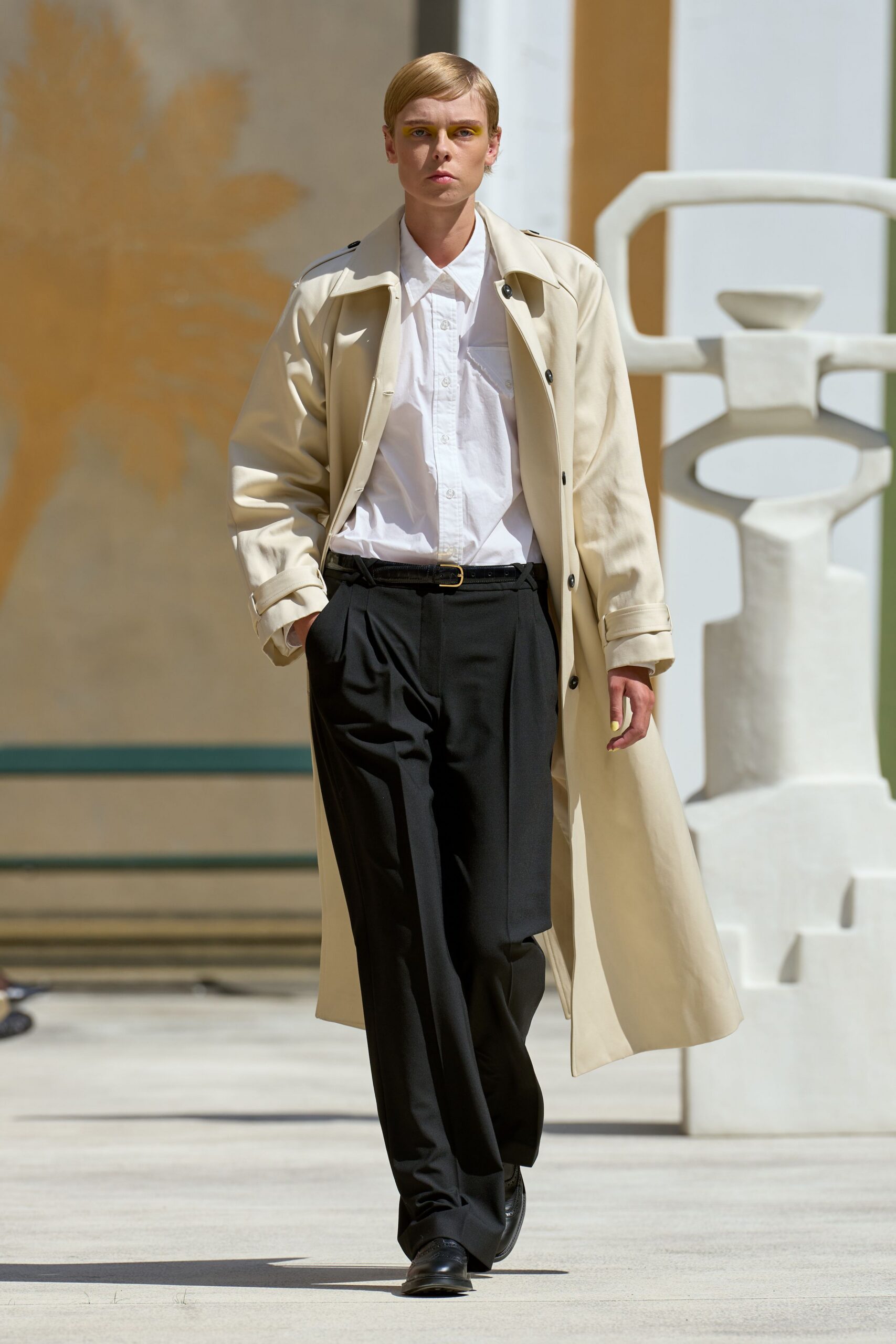 beige coat white shirt black pants