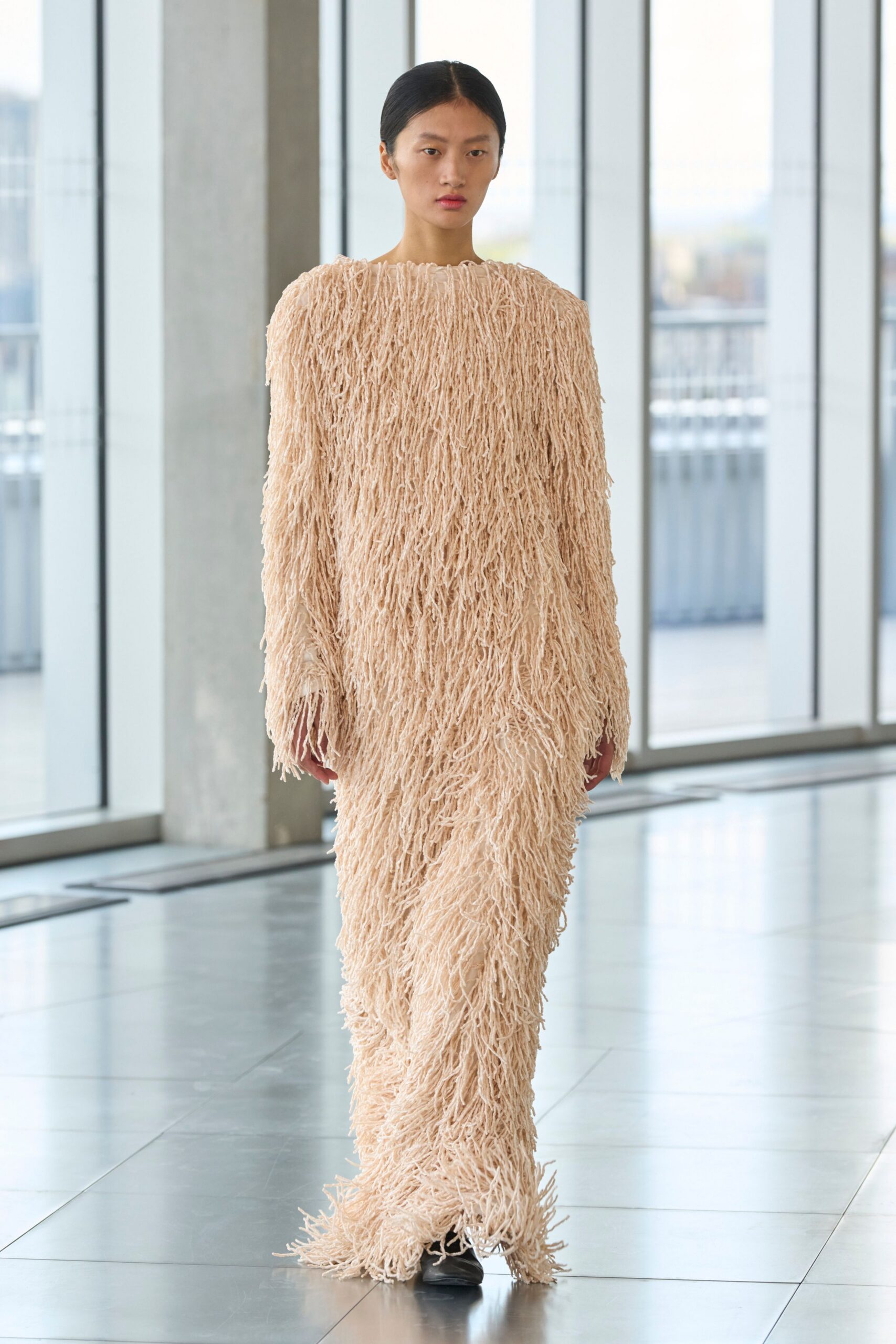 beige fringed long-sleeve gown