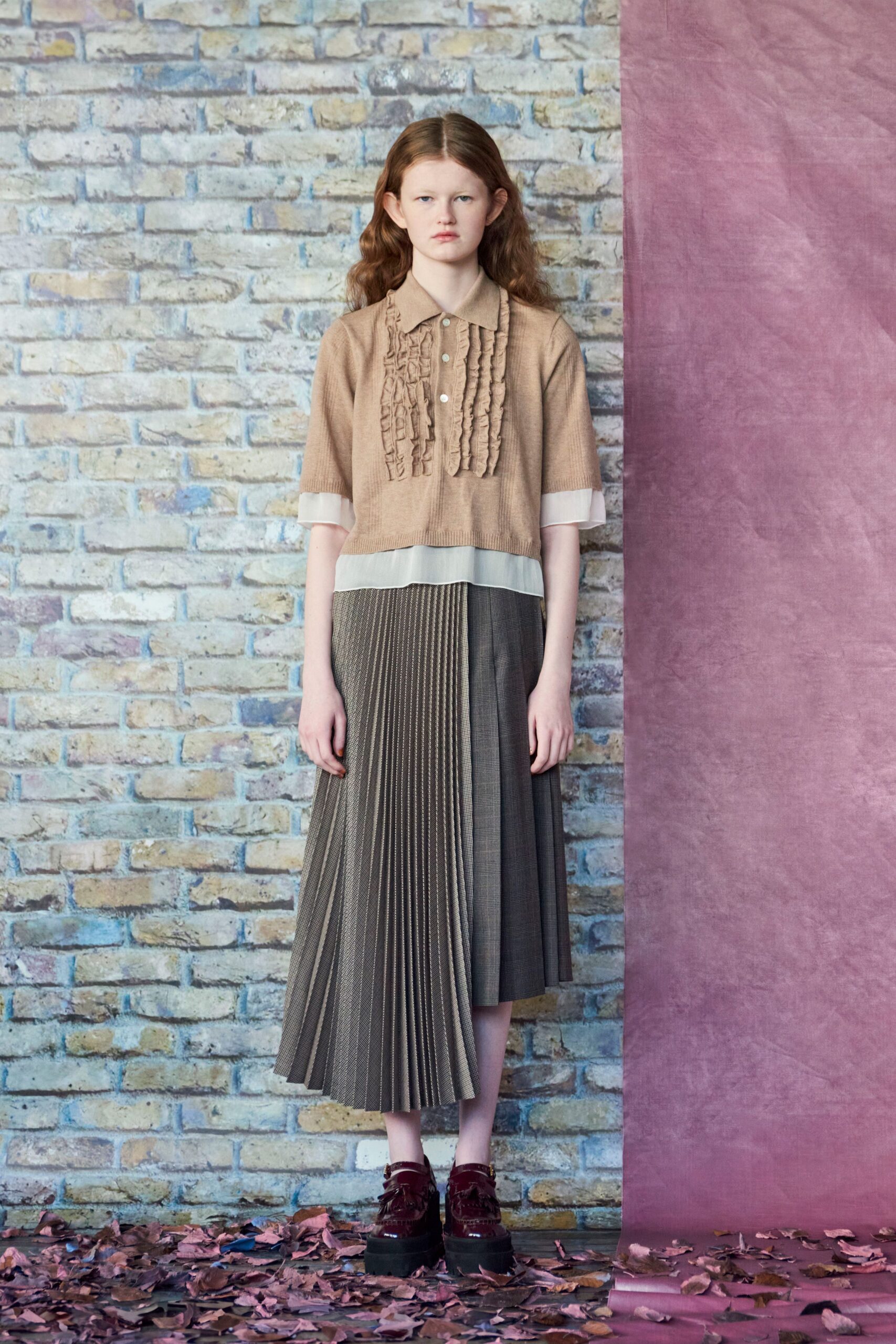 beige top gray pleated skirt