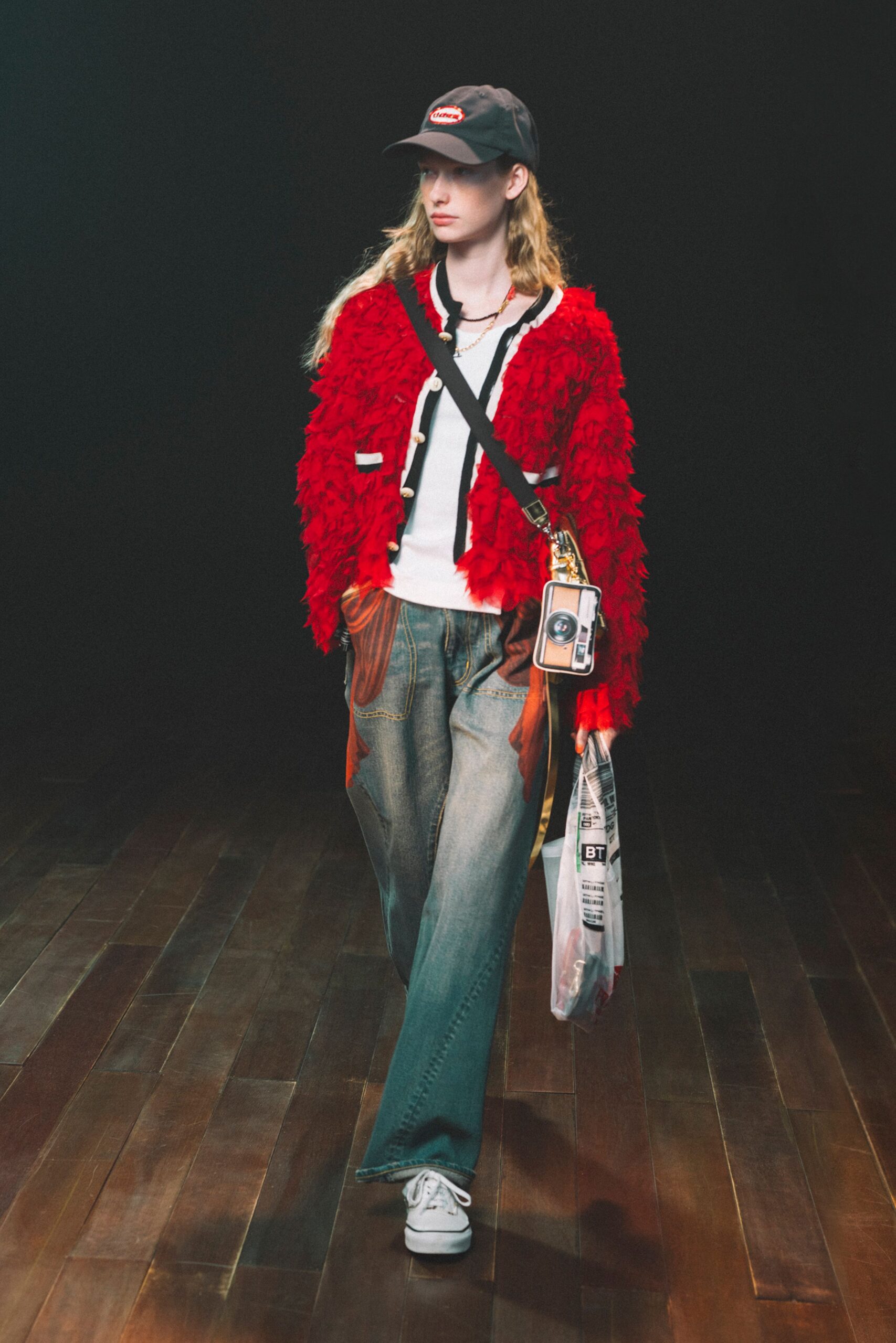 red faux-fur jacket with denim pants