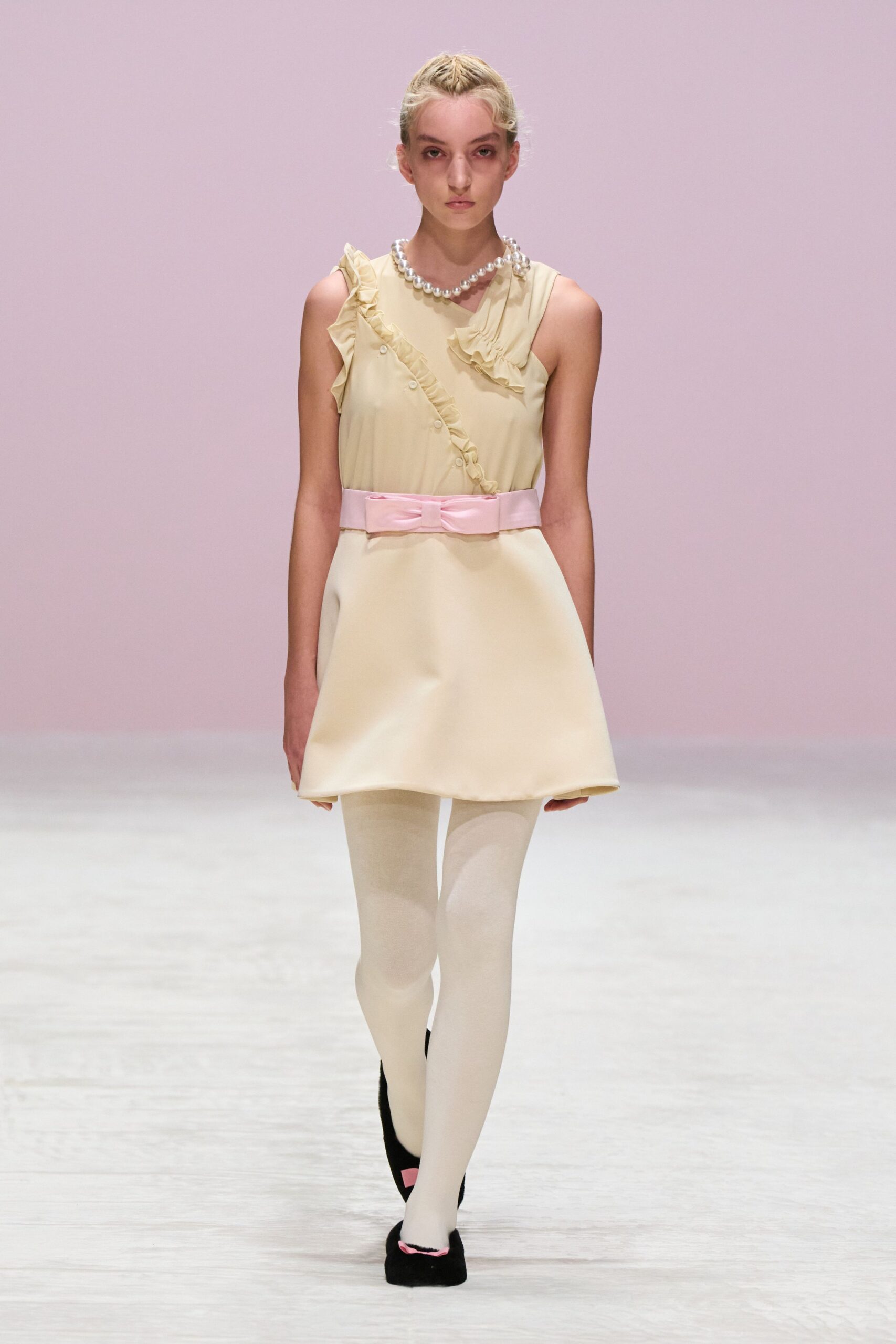 beige cotton sleeveless high-neck fitted ruffled belted dress