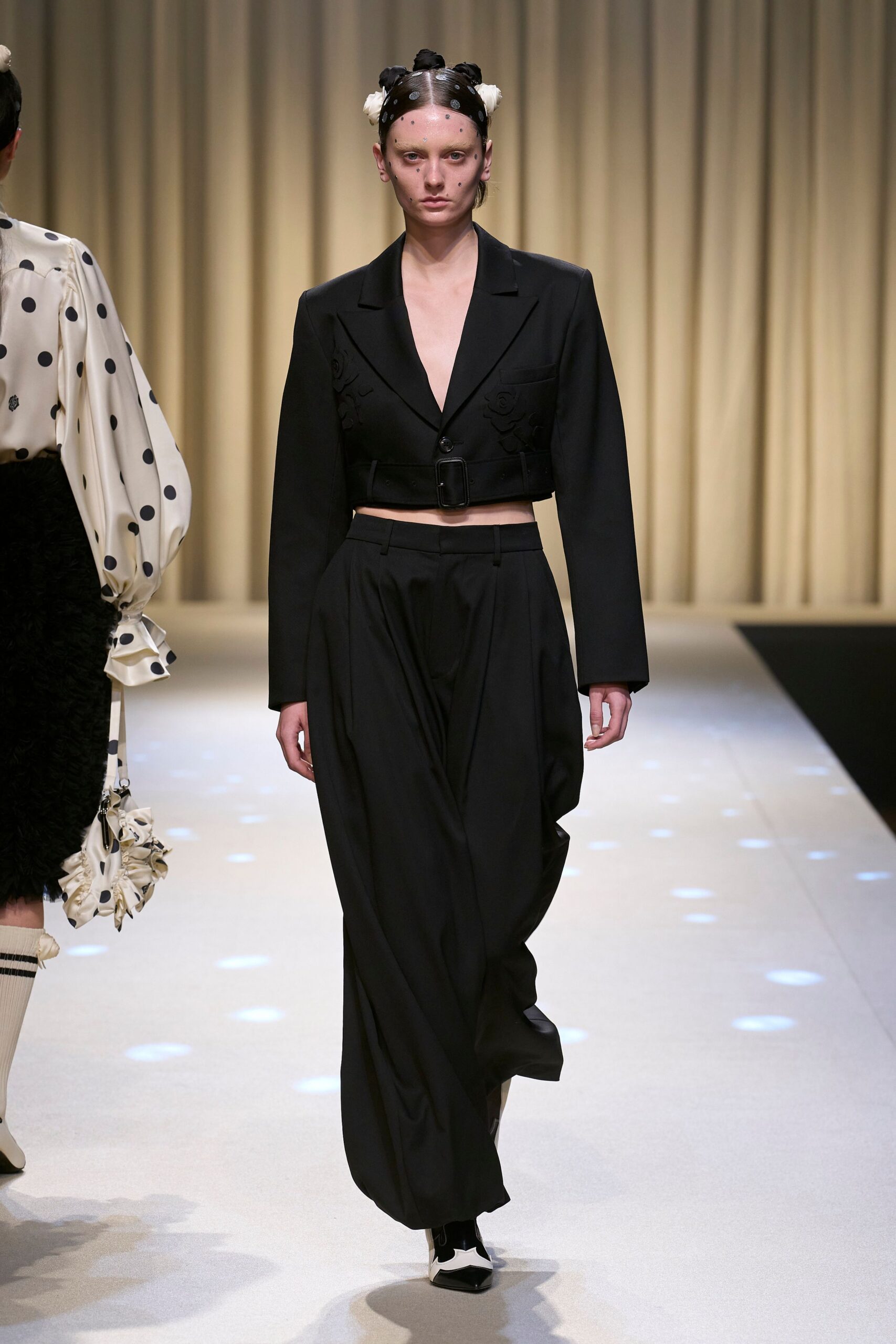 black fitted blazer and relaxed pants