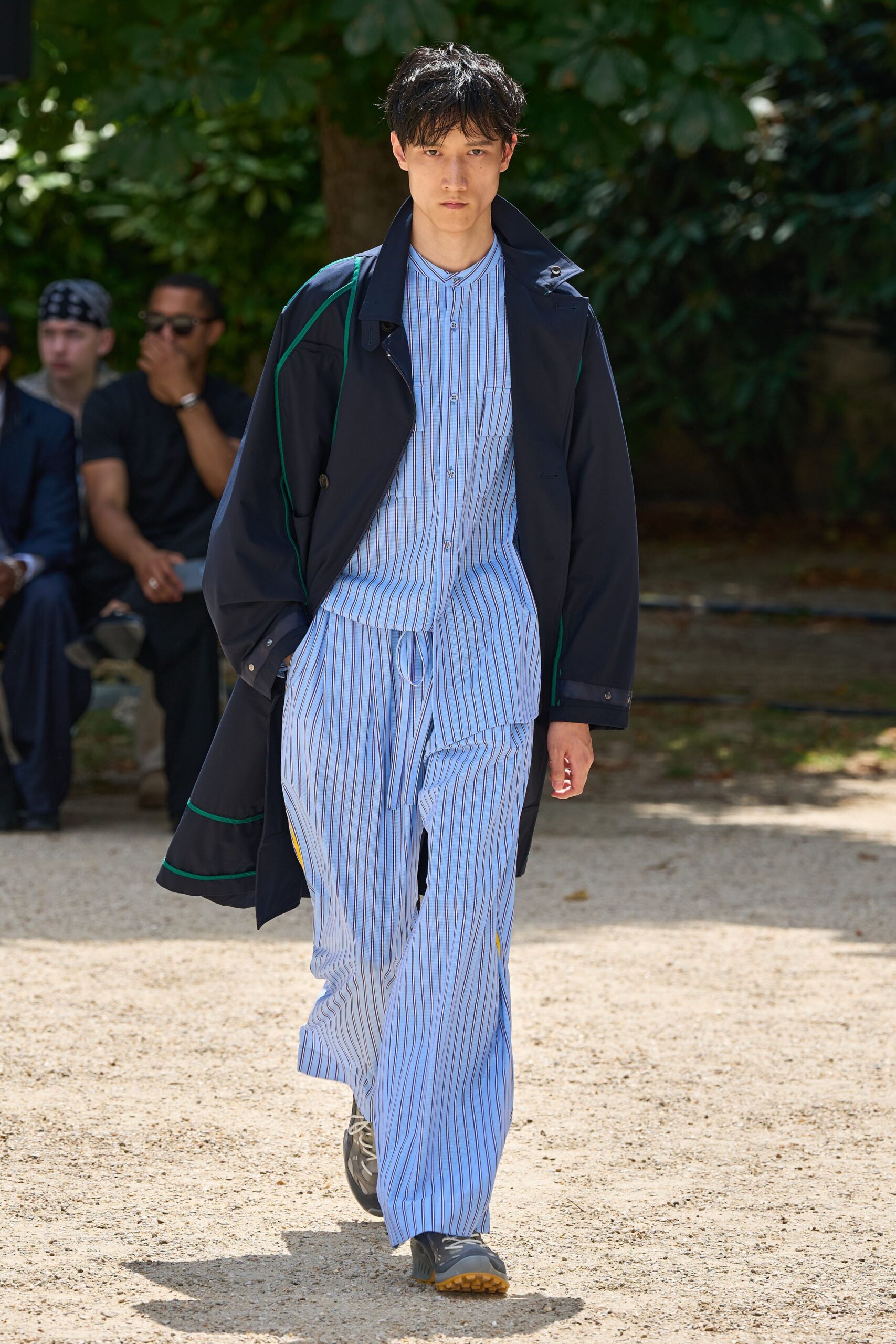 black coat with striped shirt and pants