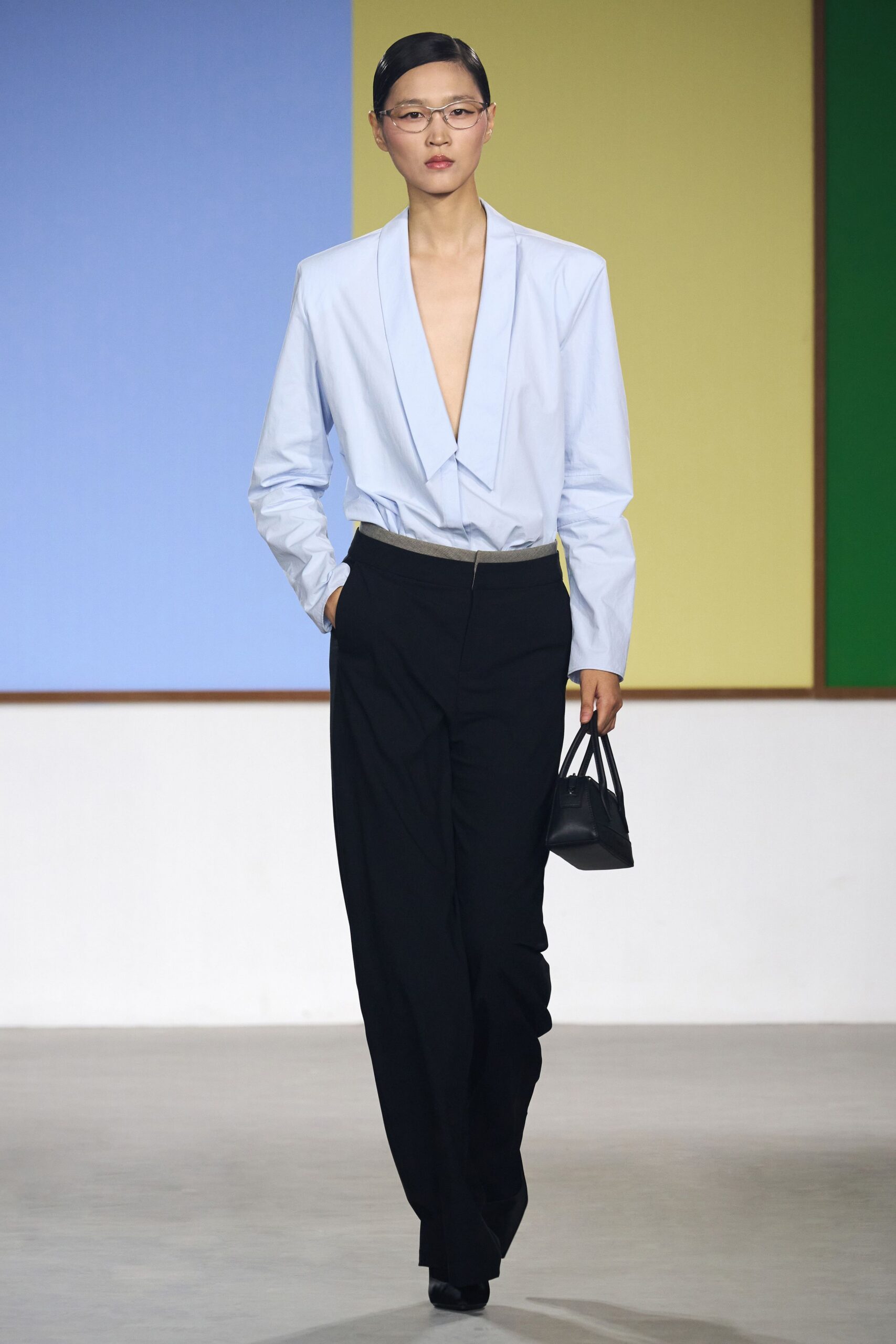 light blue fitted shirt with black pants