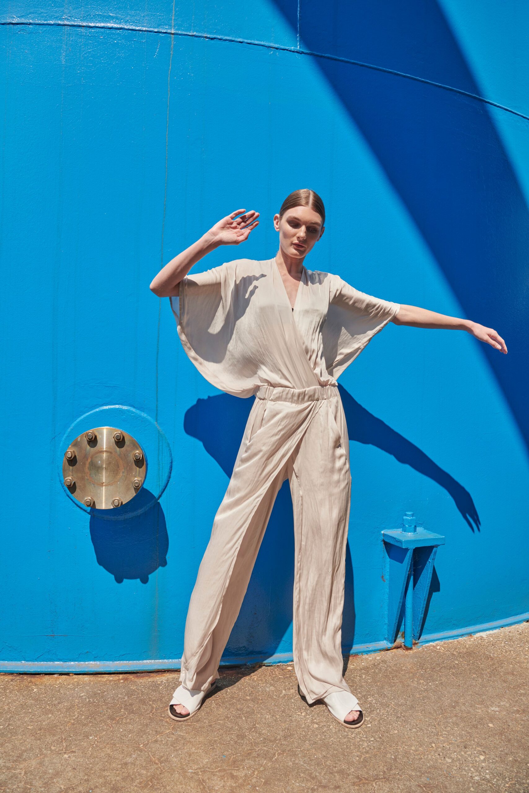 beige silk sleeveless v-neck relaxed draped flowing jumpsuit