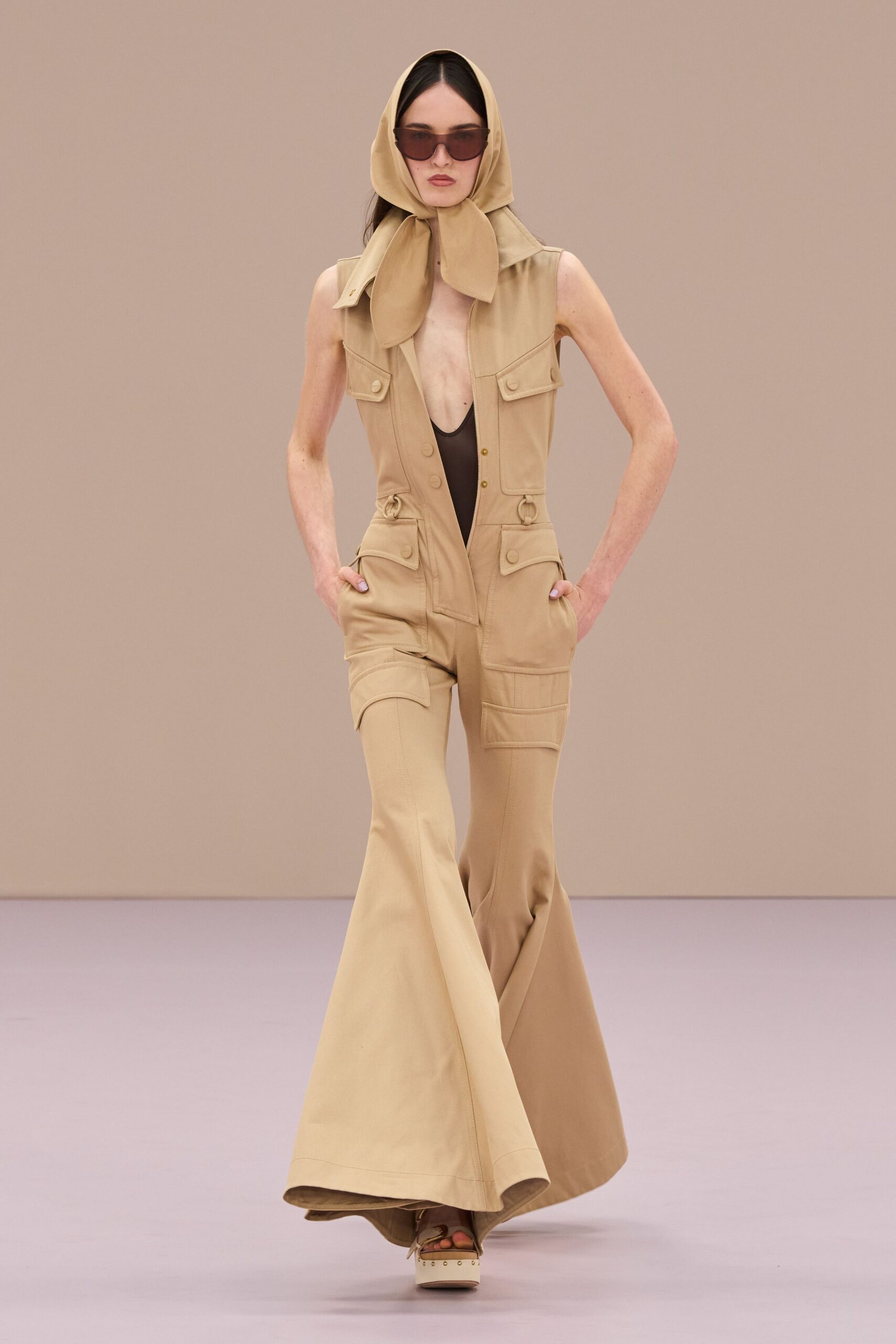 beige cotton sleeveless v-neck fitted flared pockets jumpsuit