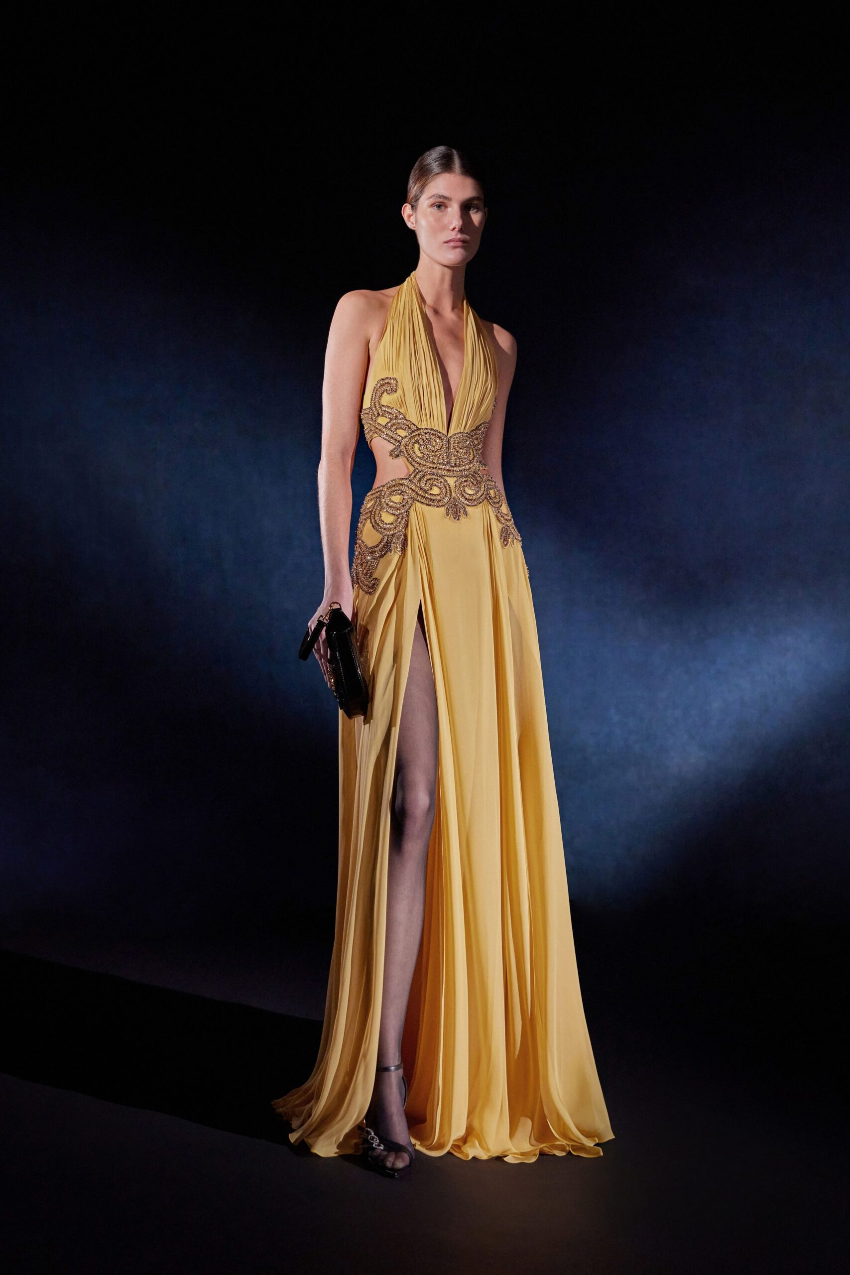 yellow silk sleeveless v-neck fitted pleated embellished gown