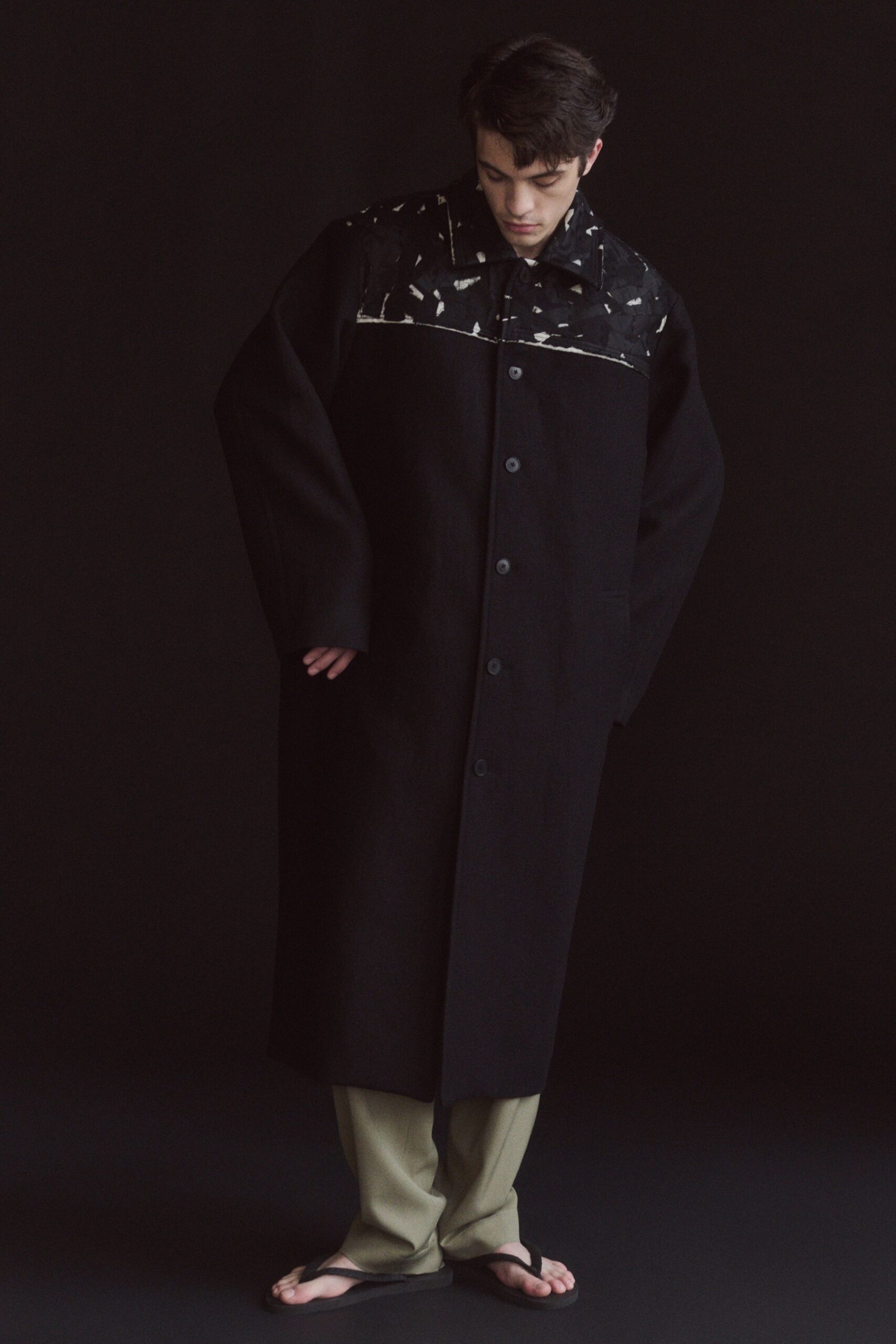 black oversized coat with beige pants