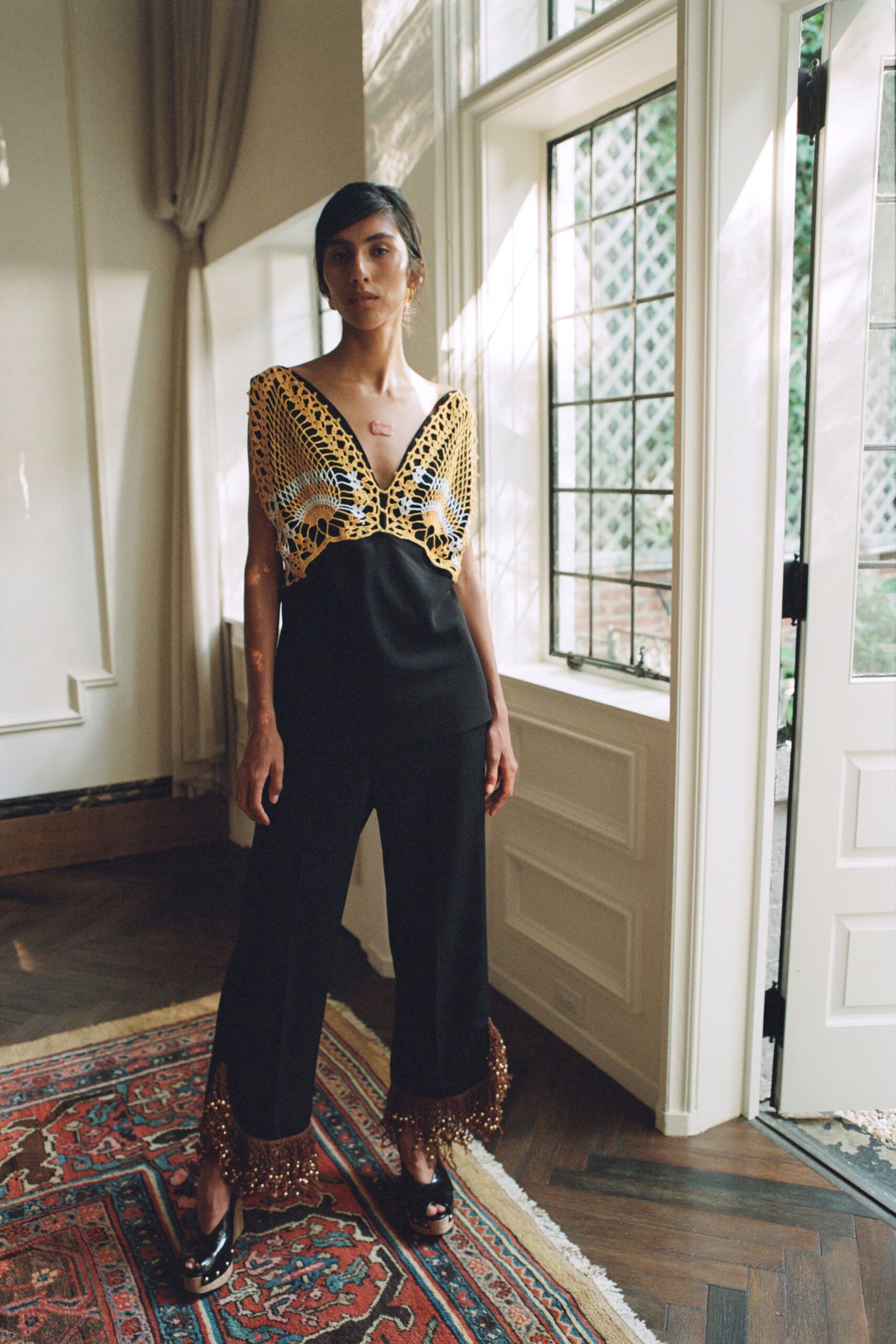 black fitted jumpsuit with beaded detail