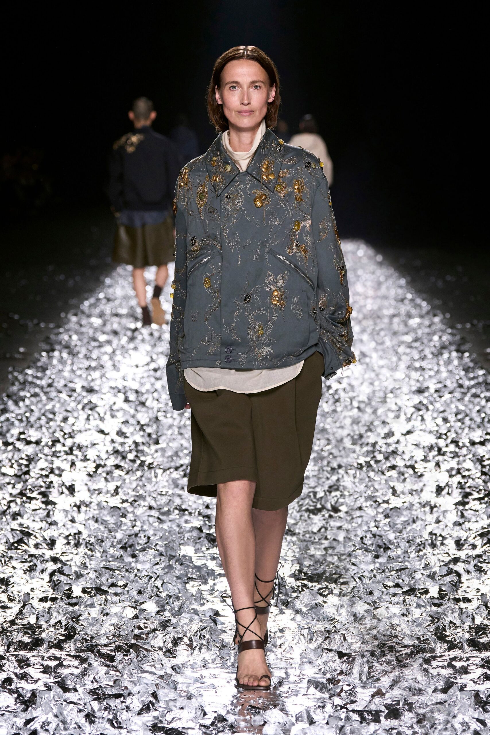 blue embroidered jacket with green skirt
