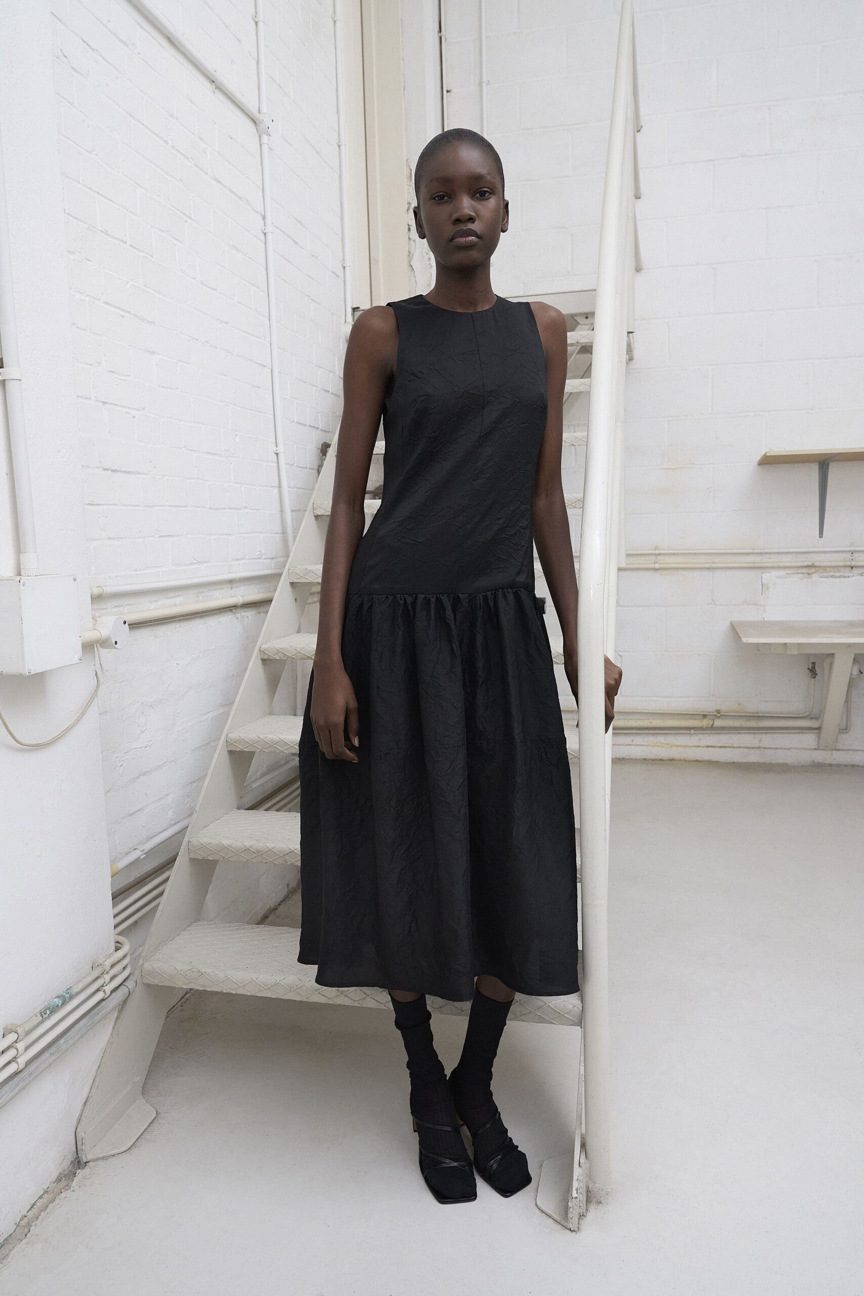 black midi dress with tiered design