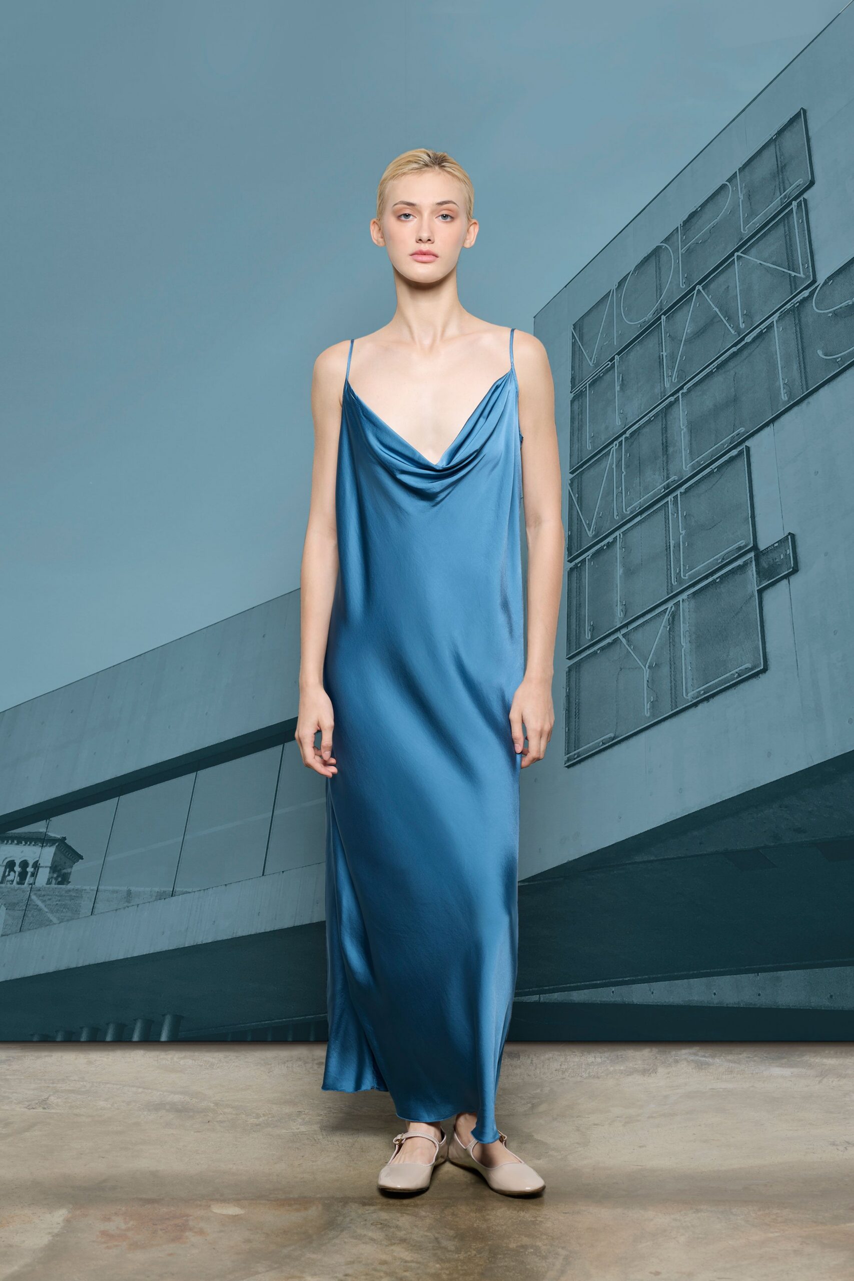 blue silk sleeveless v-neck fitted draped flowing gown