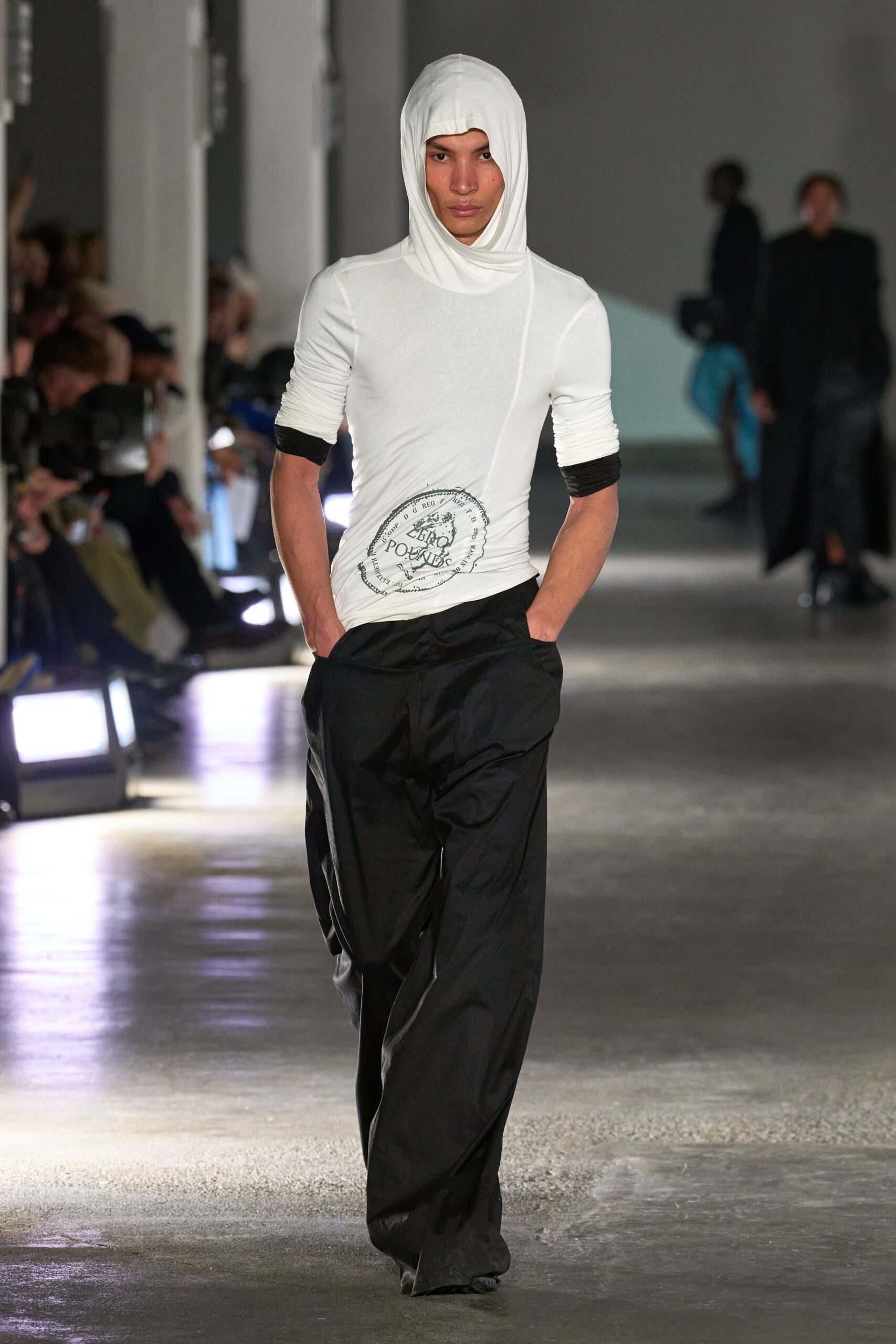 white hooded top and black pants