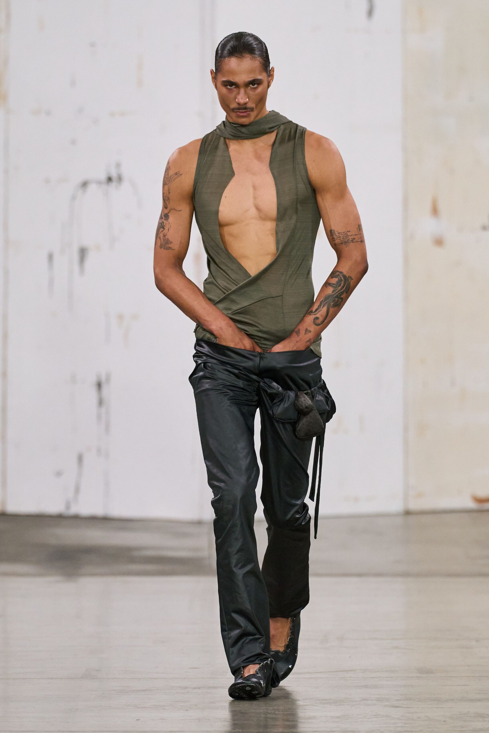 fitted green top and black pants