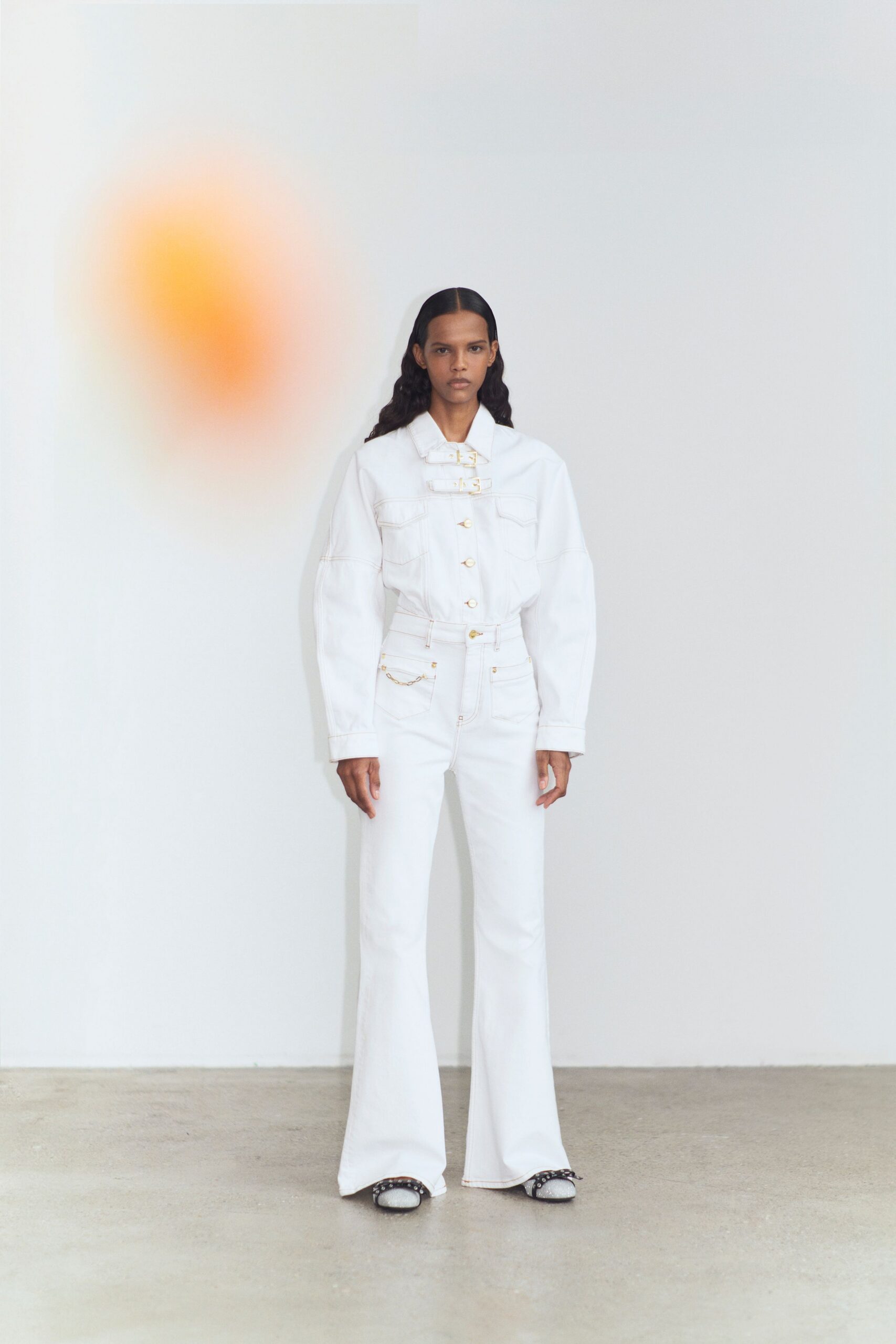white denim fitted flared pants