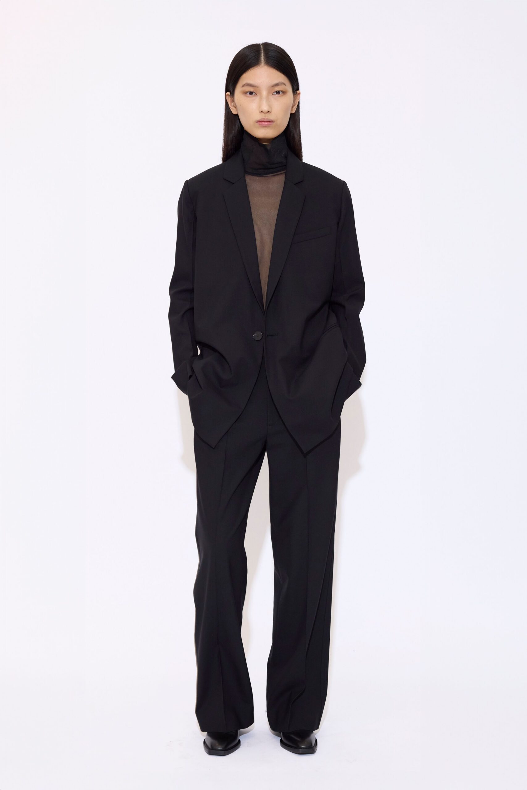 black tailored suit with sheer top
