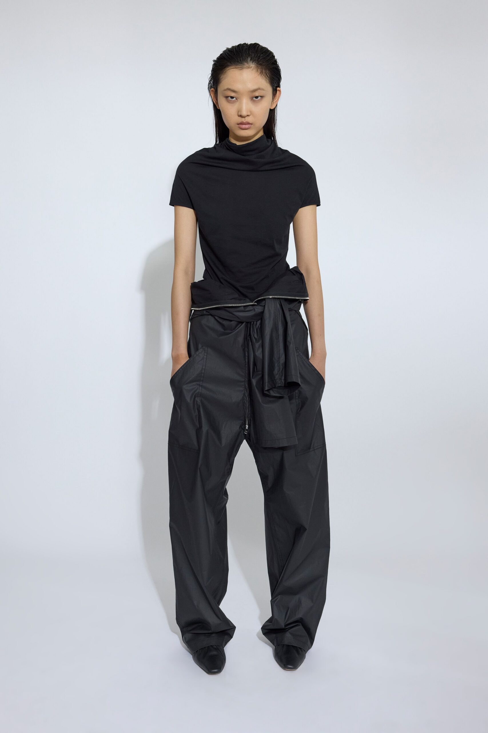 black fitted top and relaxed pants