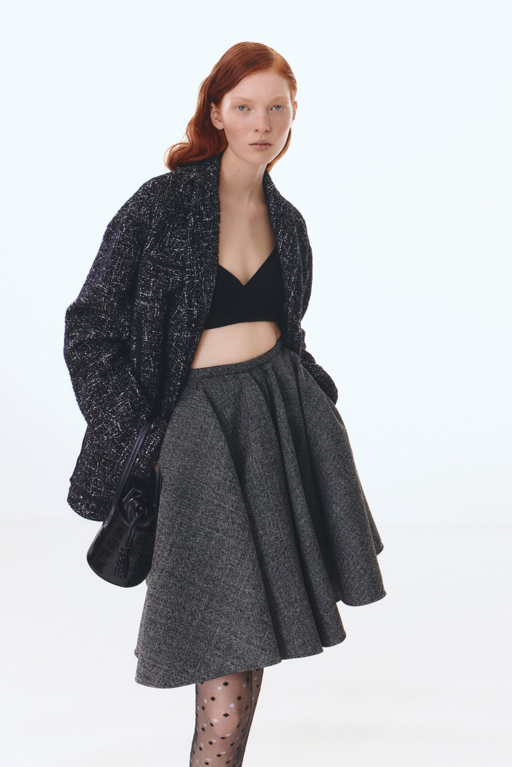 black tweed jacket with gray skirt