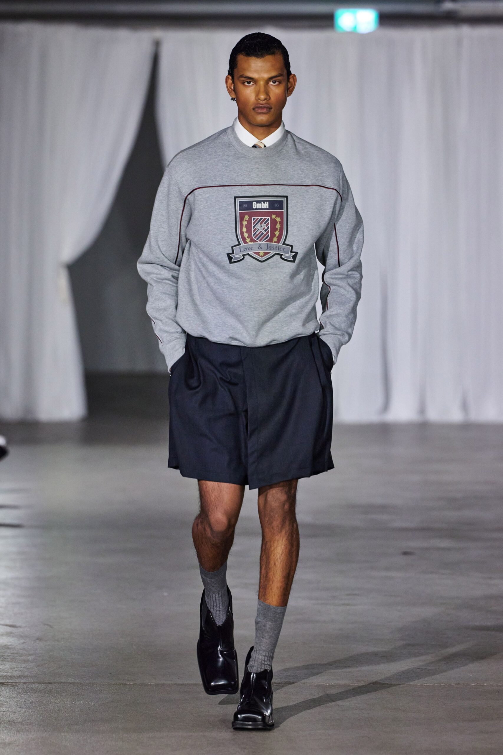 gray relaxed sweater with black shorts