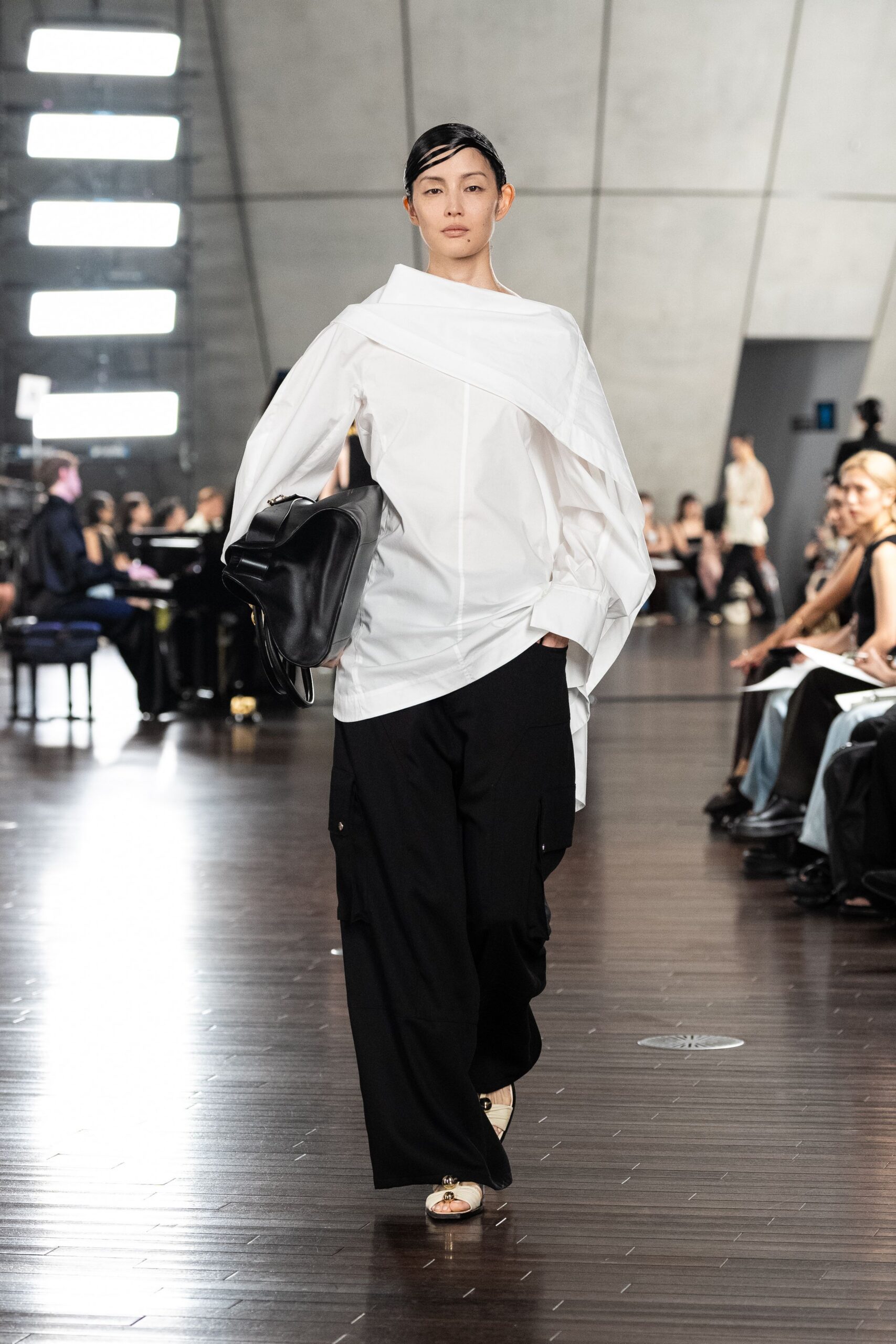 white off-shoulder shirt with black cargo pants