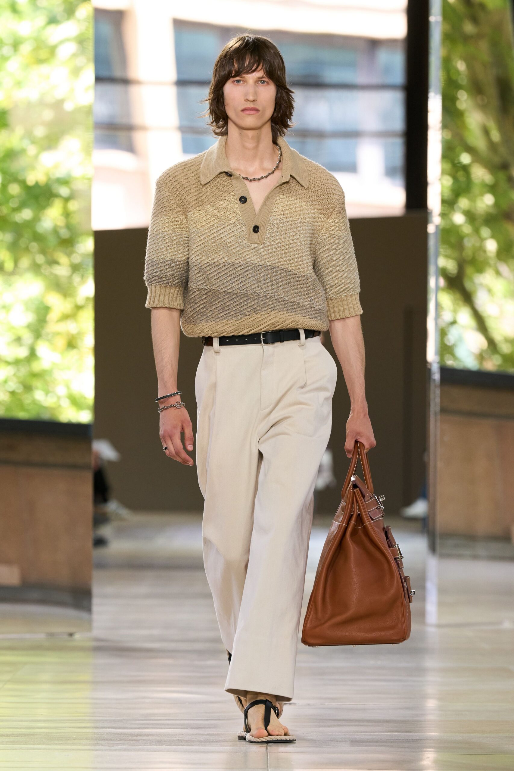 beige relaxed sweater with white tailored pants