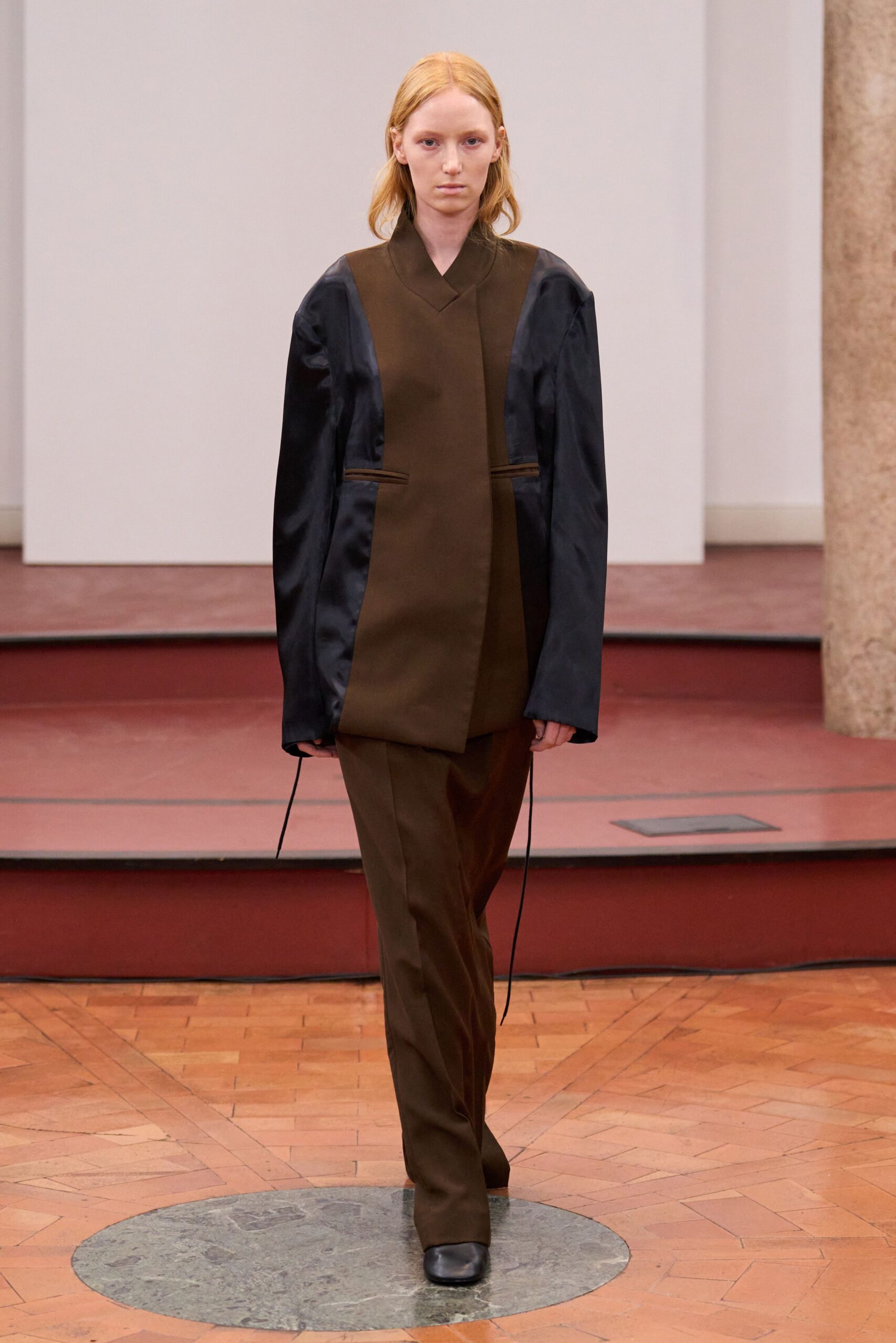 brown and black relaxed jacket with tailored pants