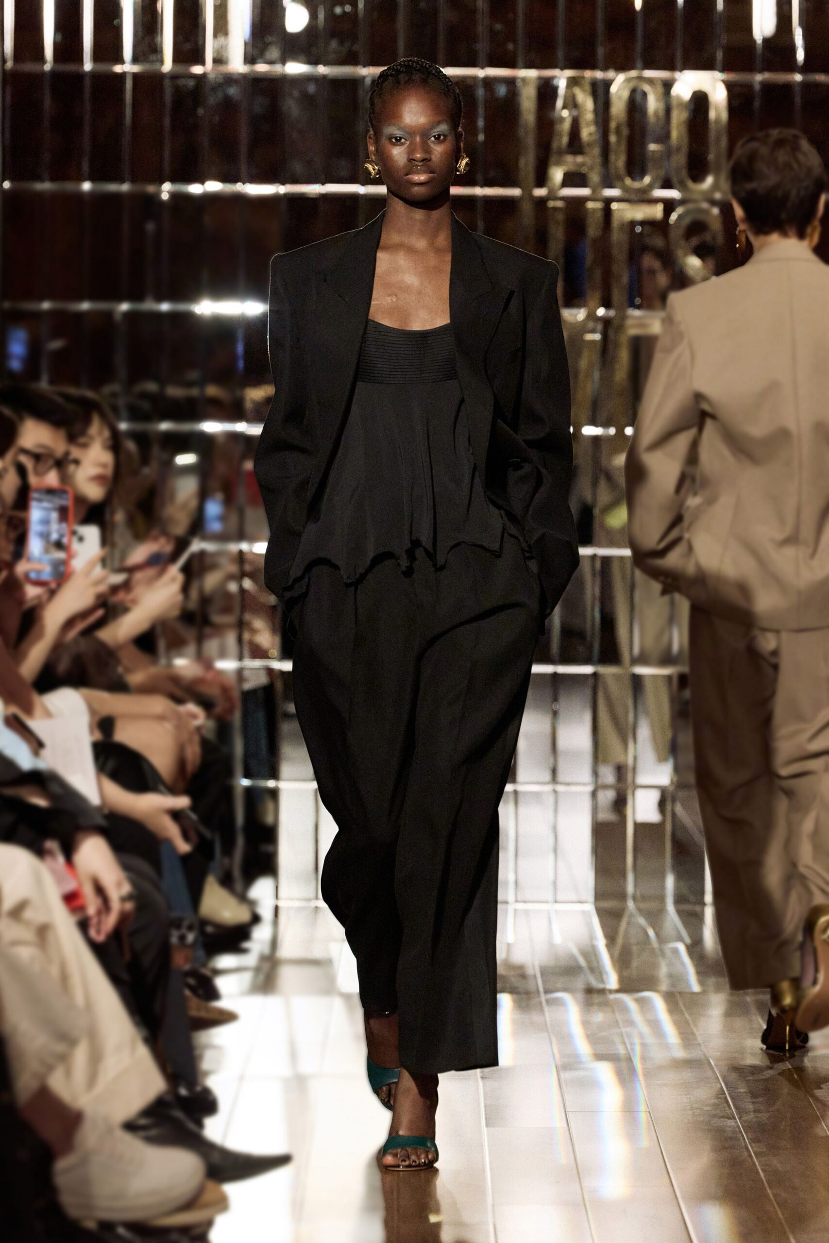 black structured blazer and top with wide-leg pants