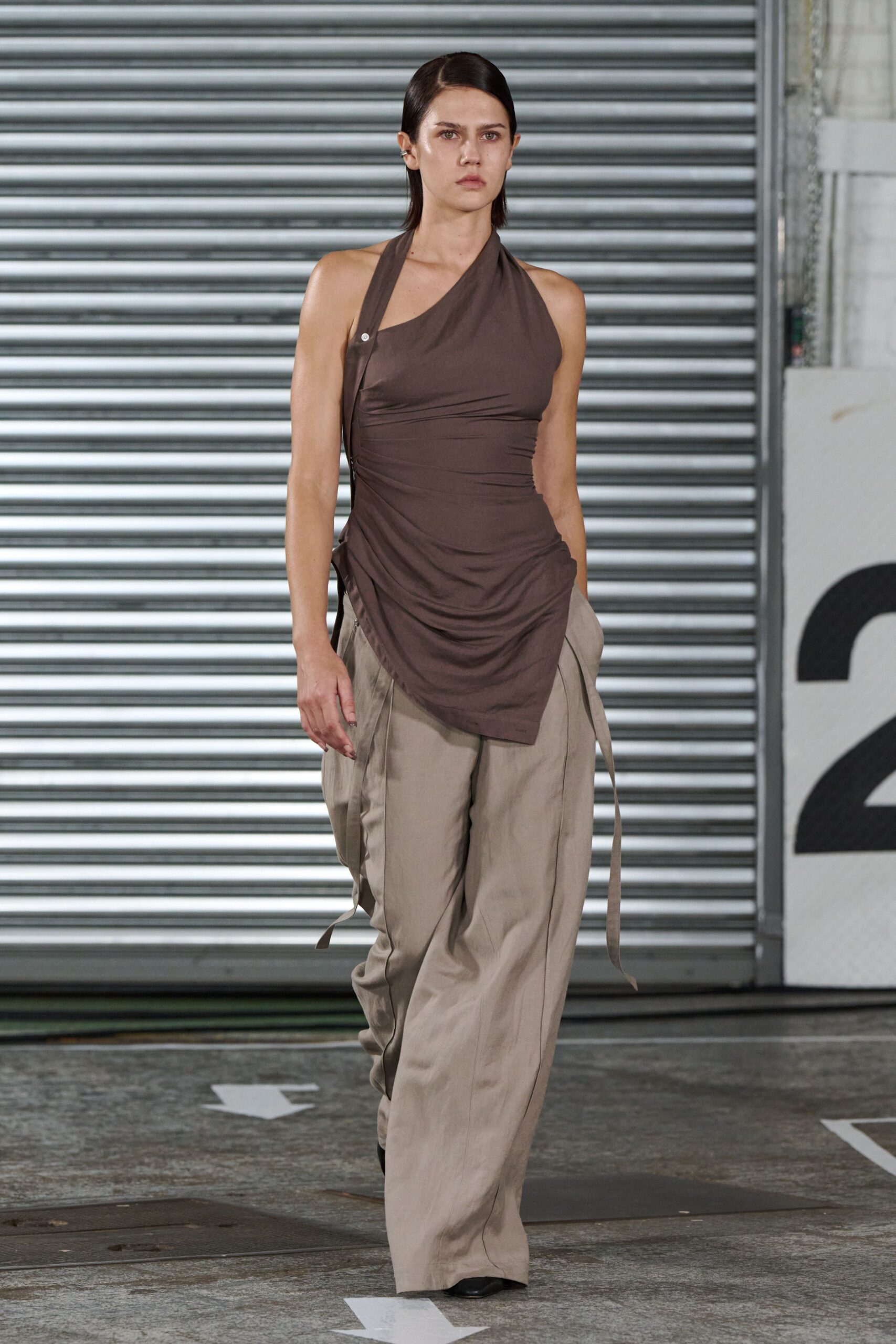 brown fitted top and beige relaxed pants