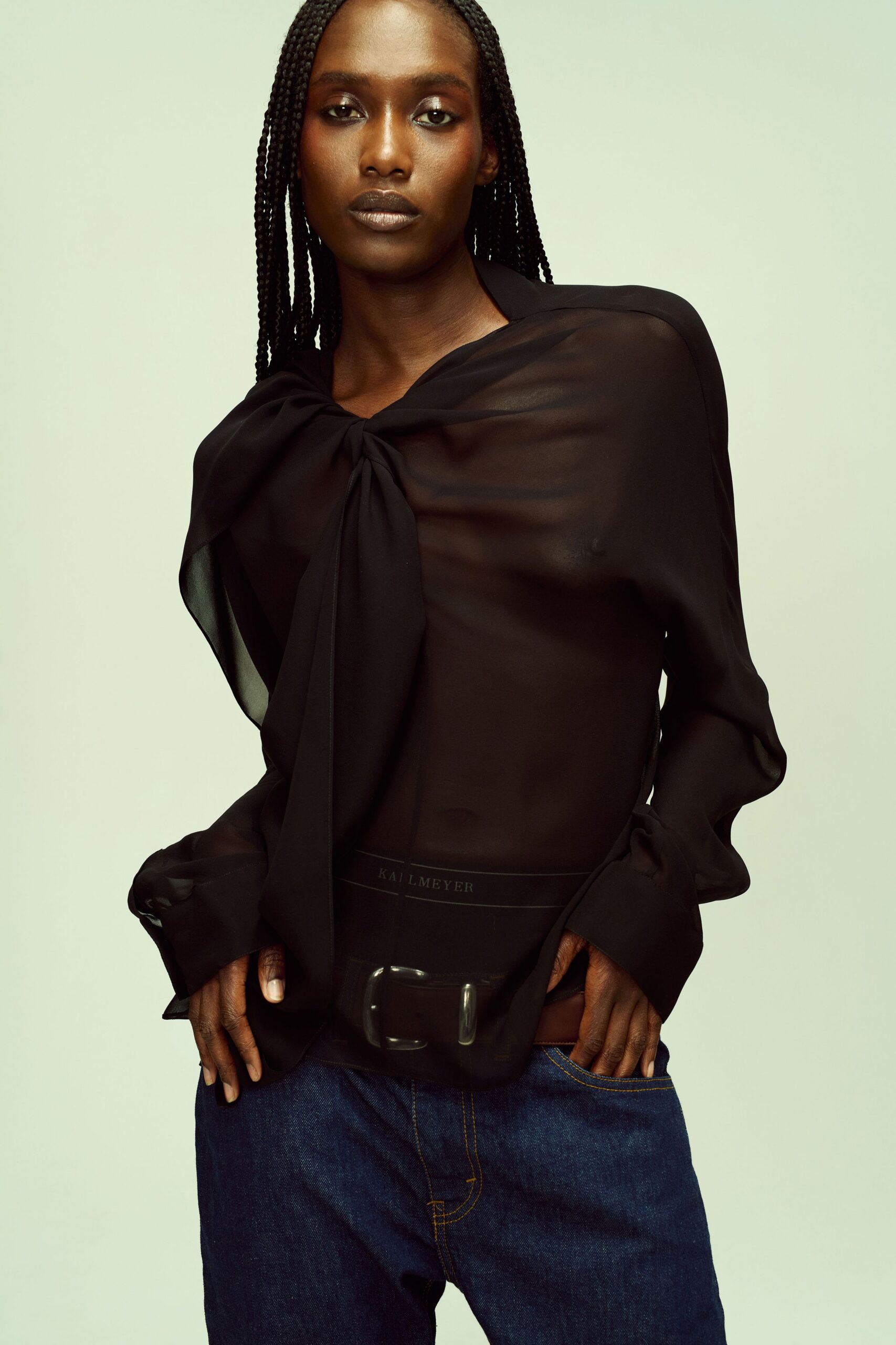 black sheer blouse with denim pants