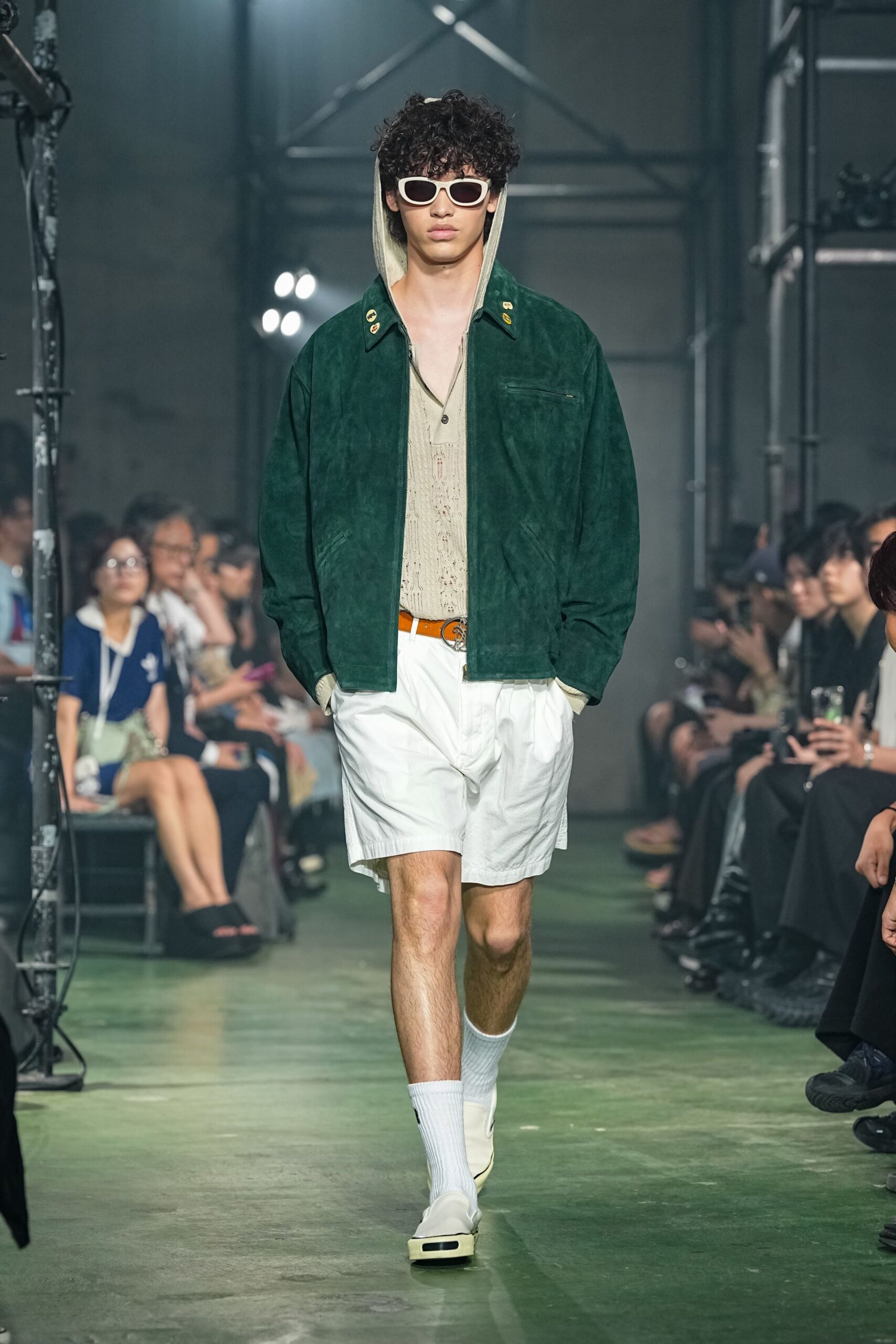 green hoodie beige top white shorts