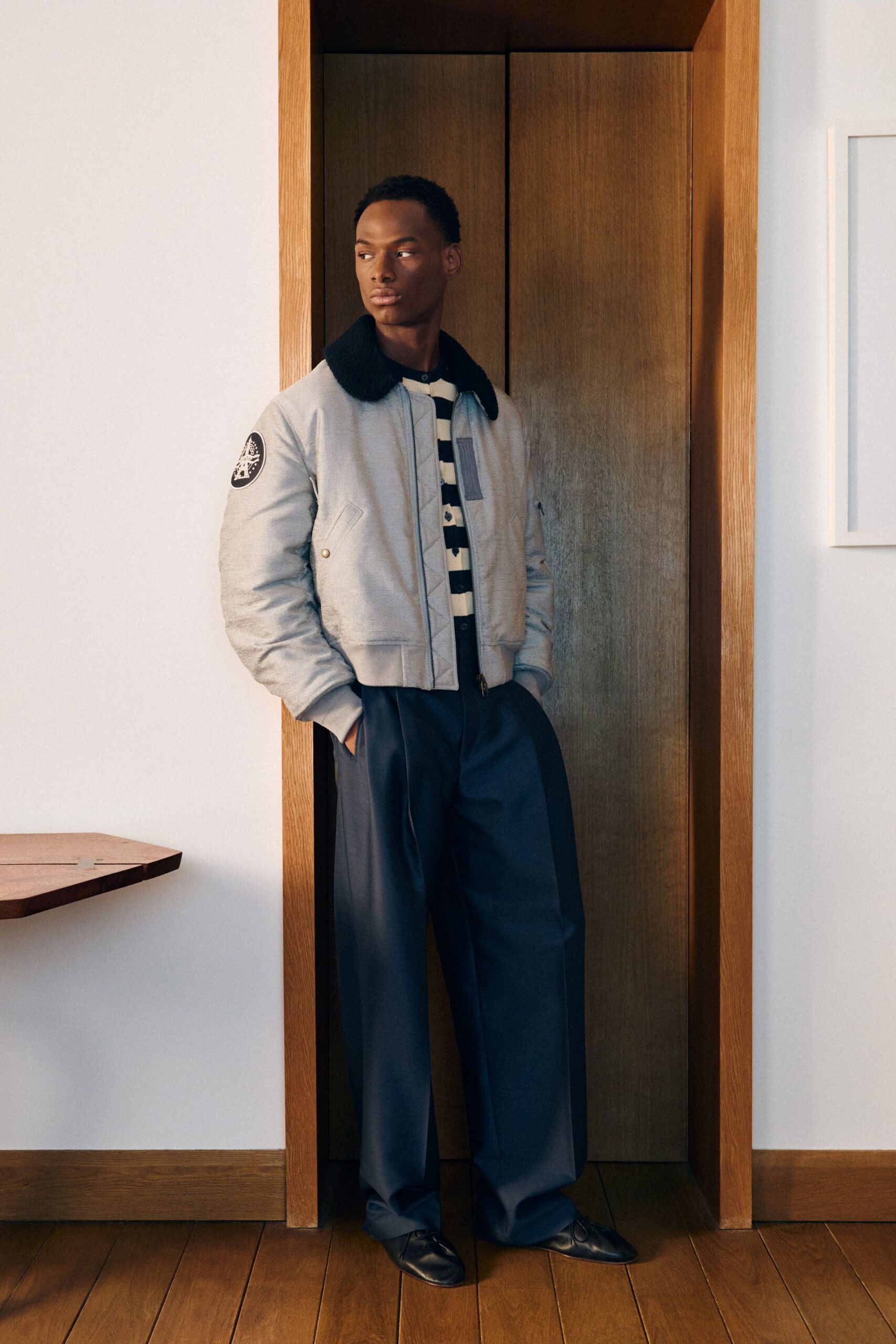 gray relaxed jacket with navy pants