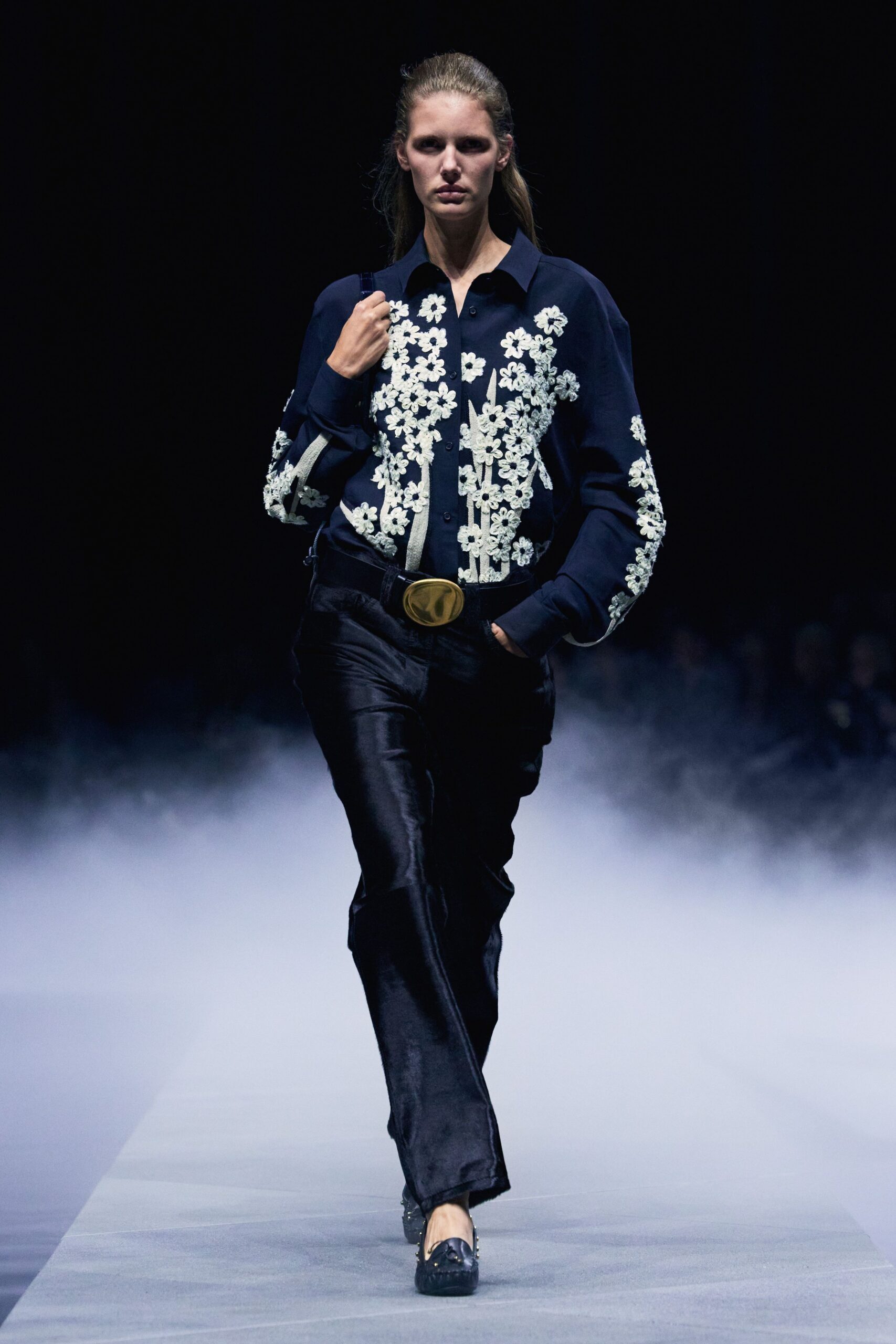 blue embroidered shirt with black pants