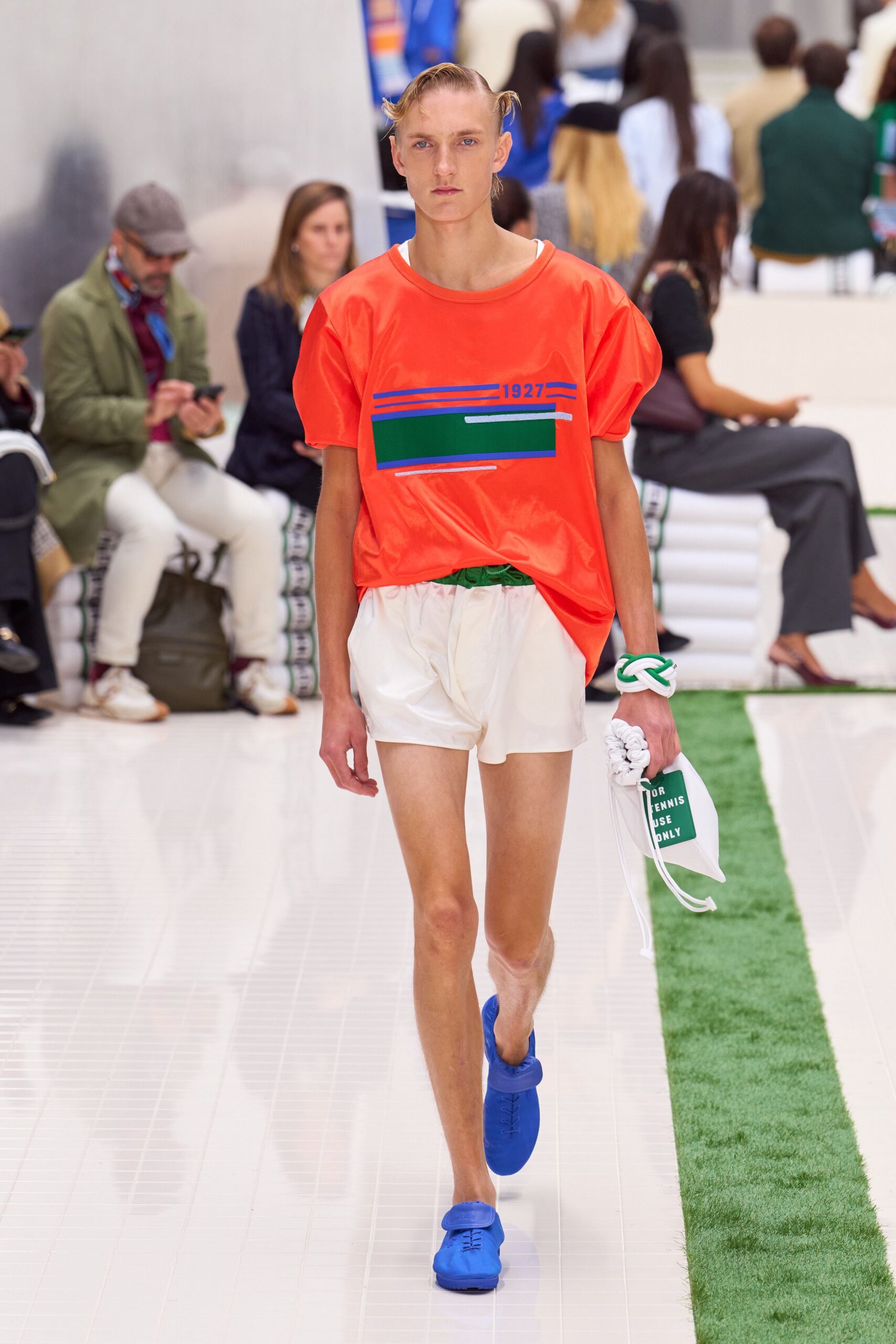 orange relaxed top with white shorts