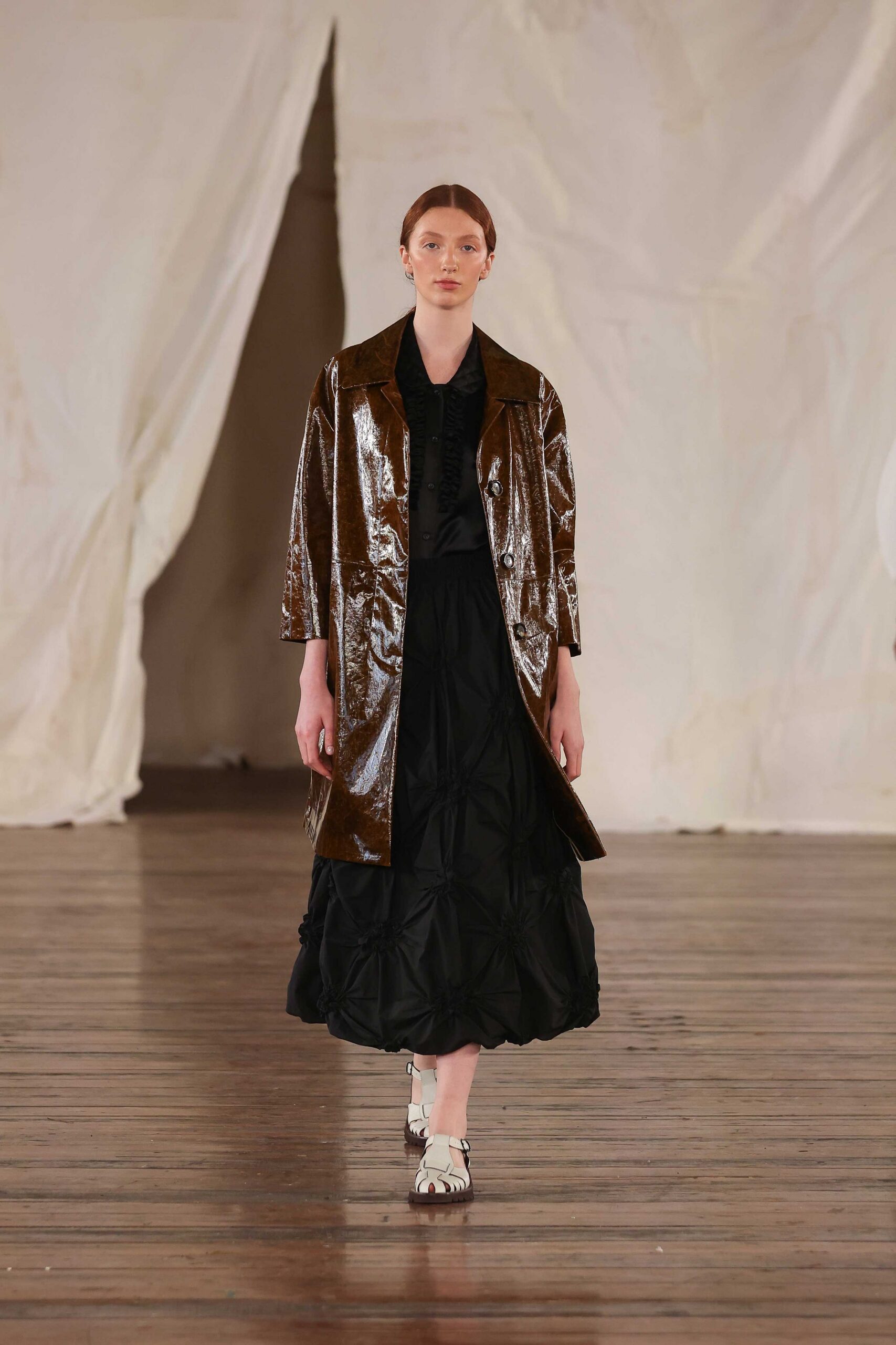 brown vinyl coat black midi dress