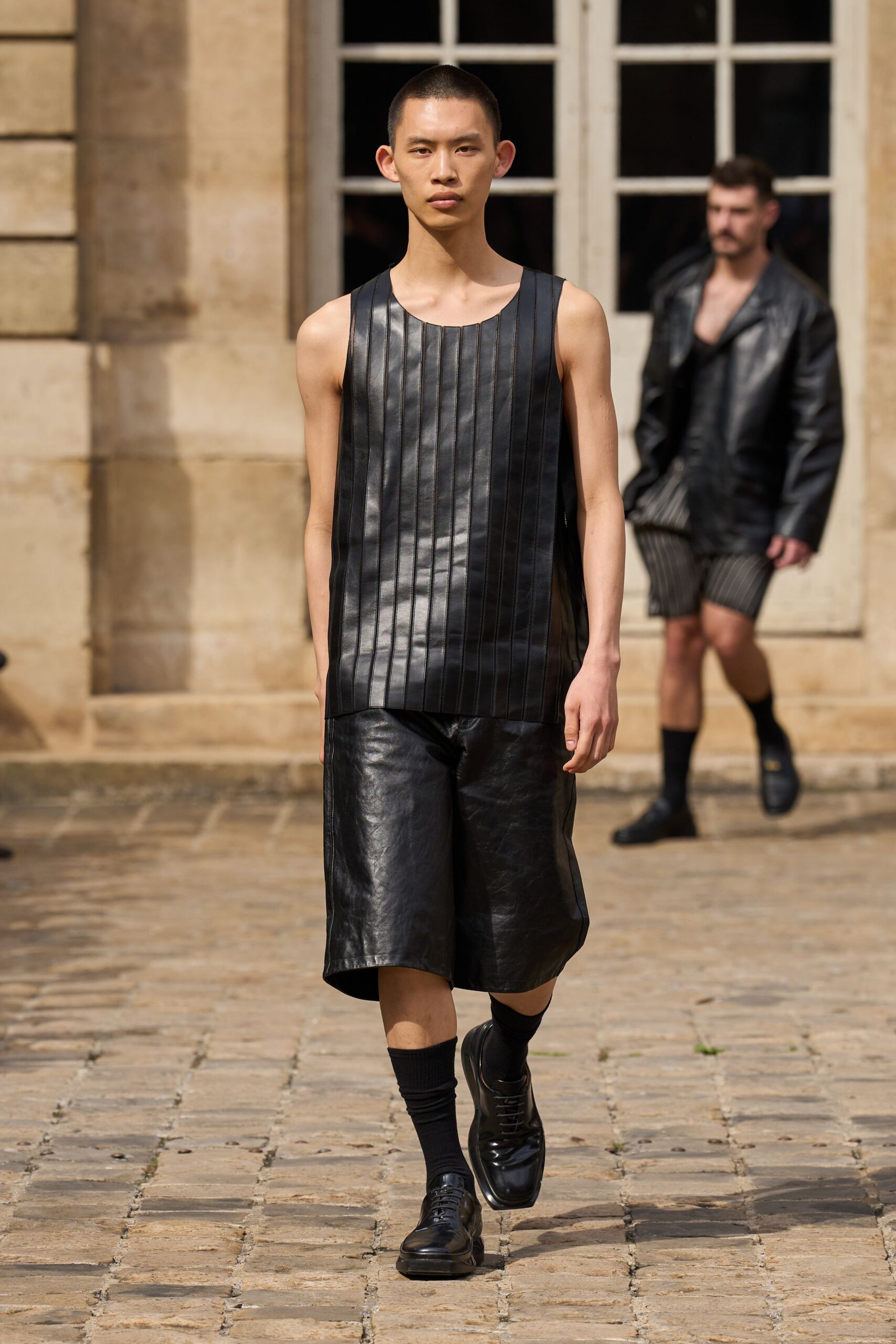 black leather sleeveless top and shorts