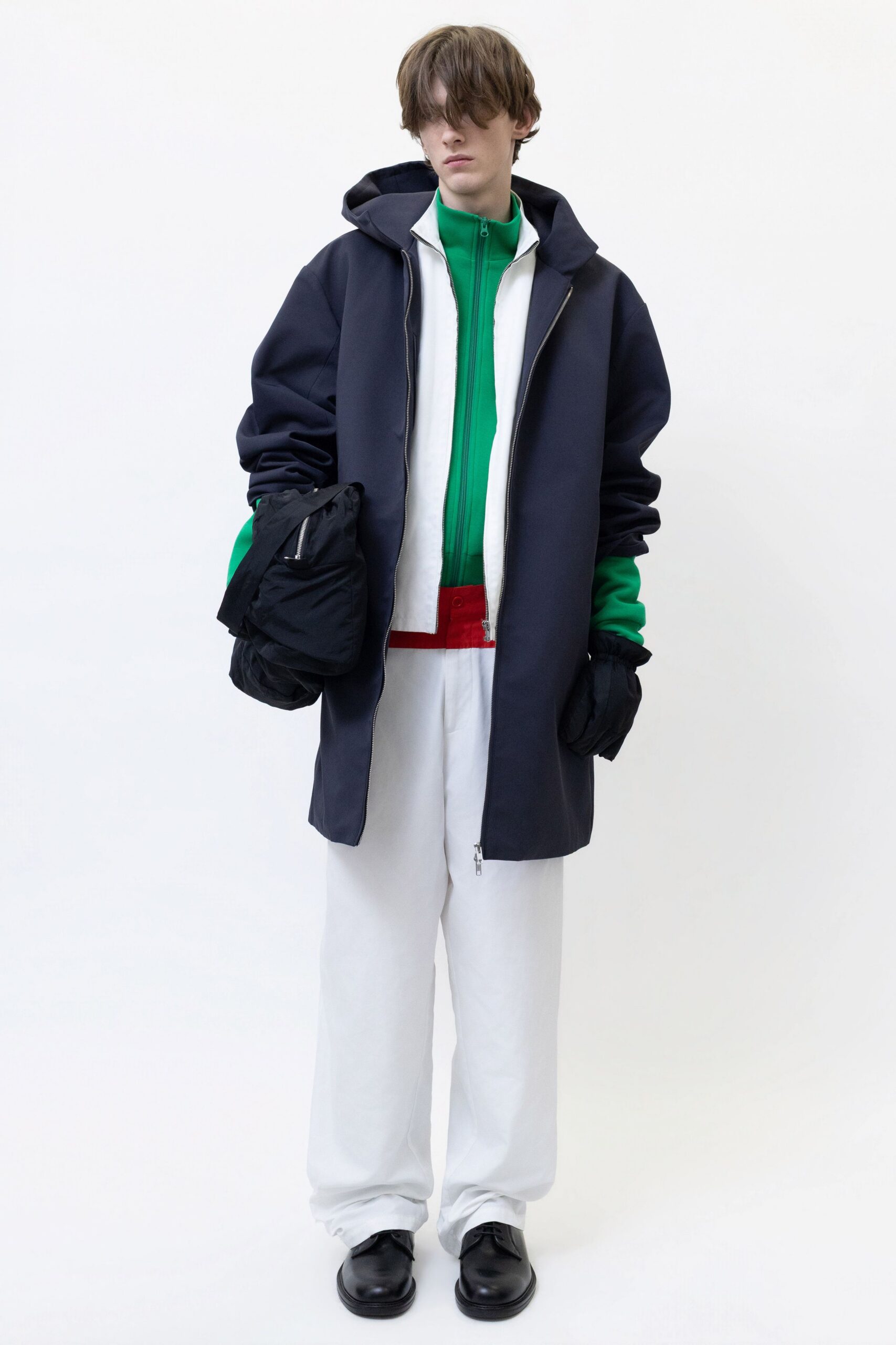 navy coat green hoodie white pants