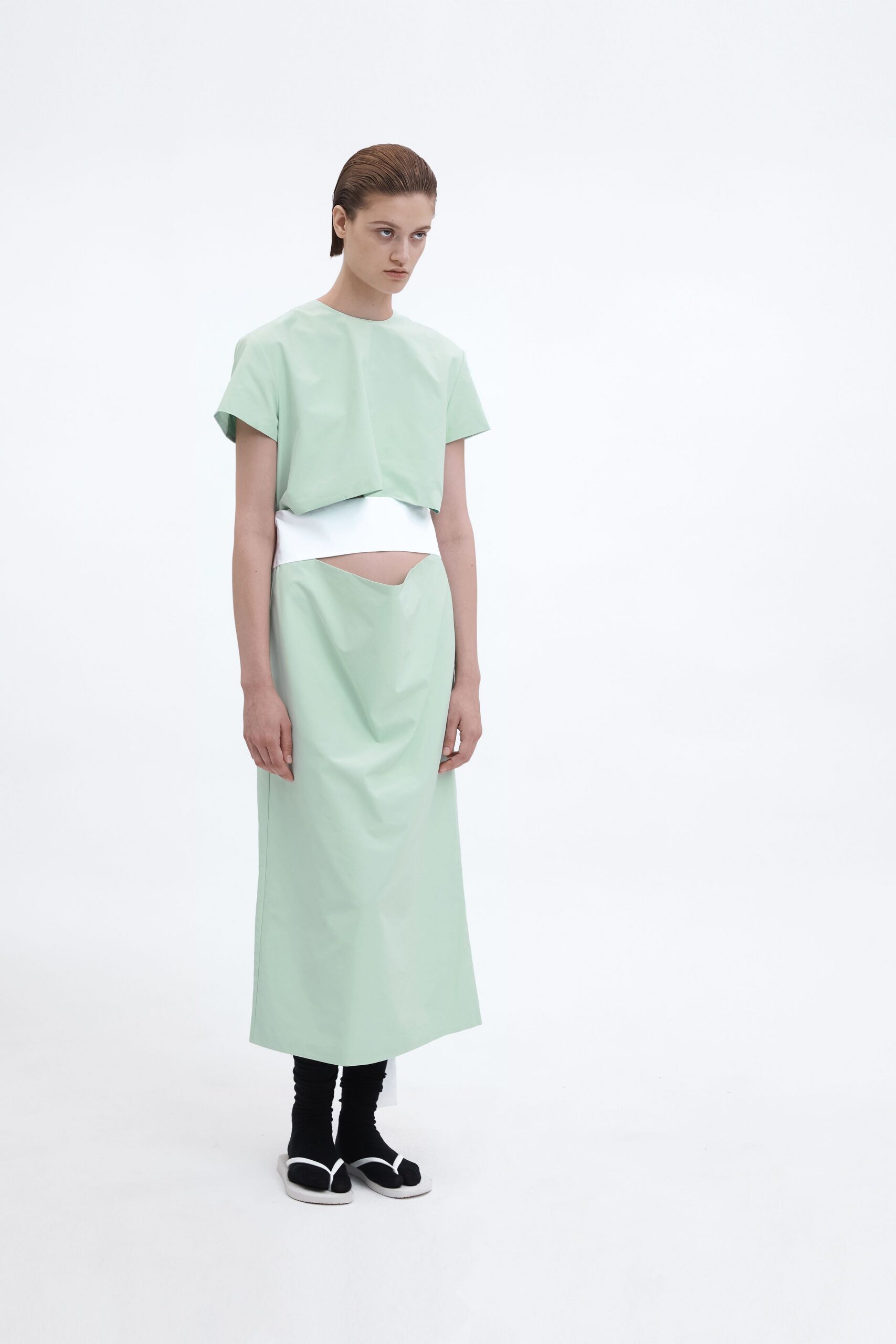 green vinyl sleeveless high-neck relaxed cropped top