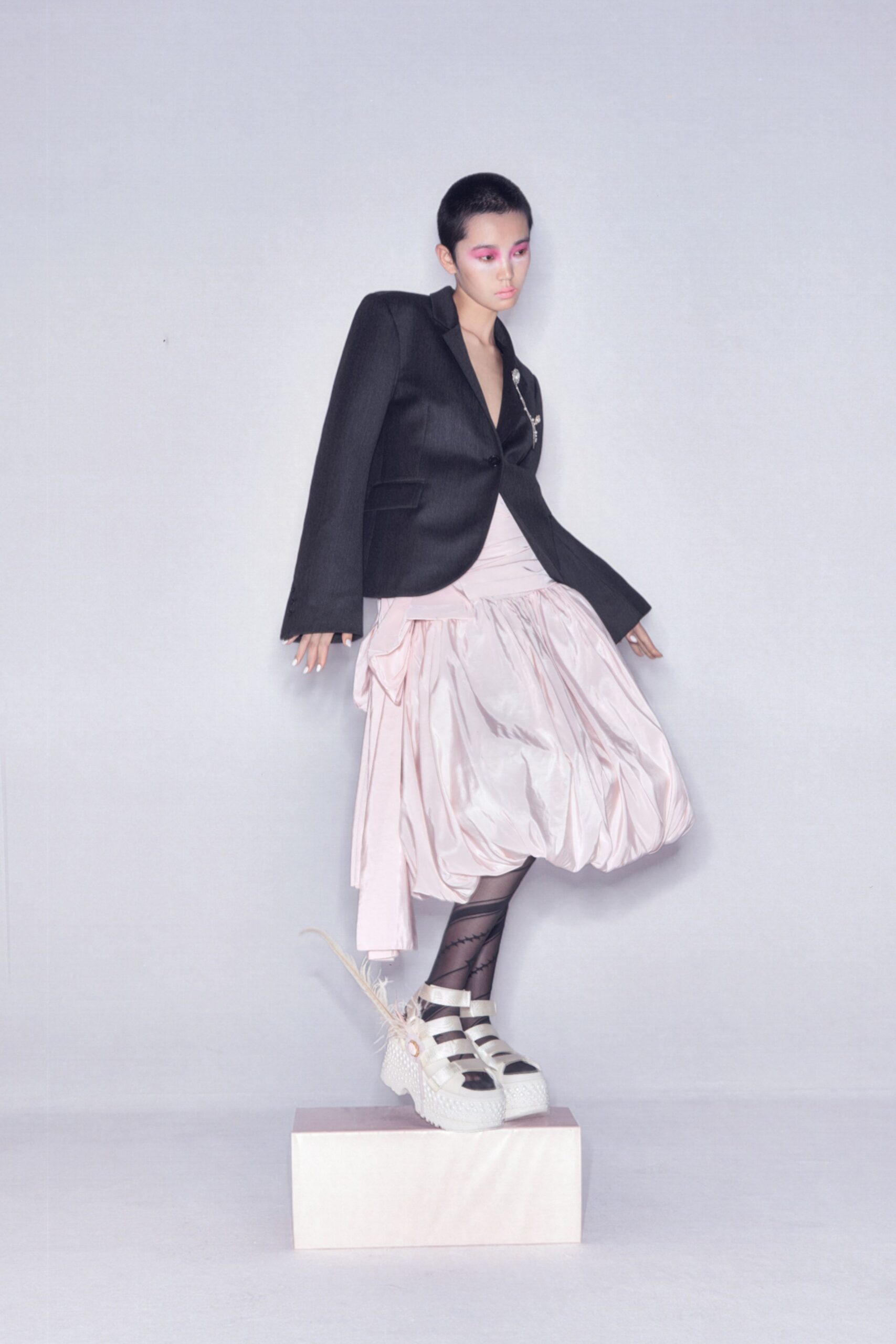 black blazer white top pink skirt