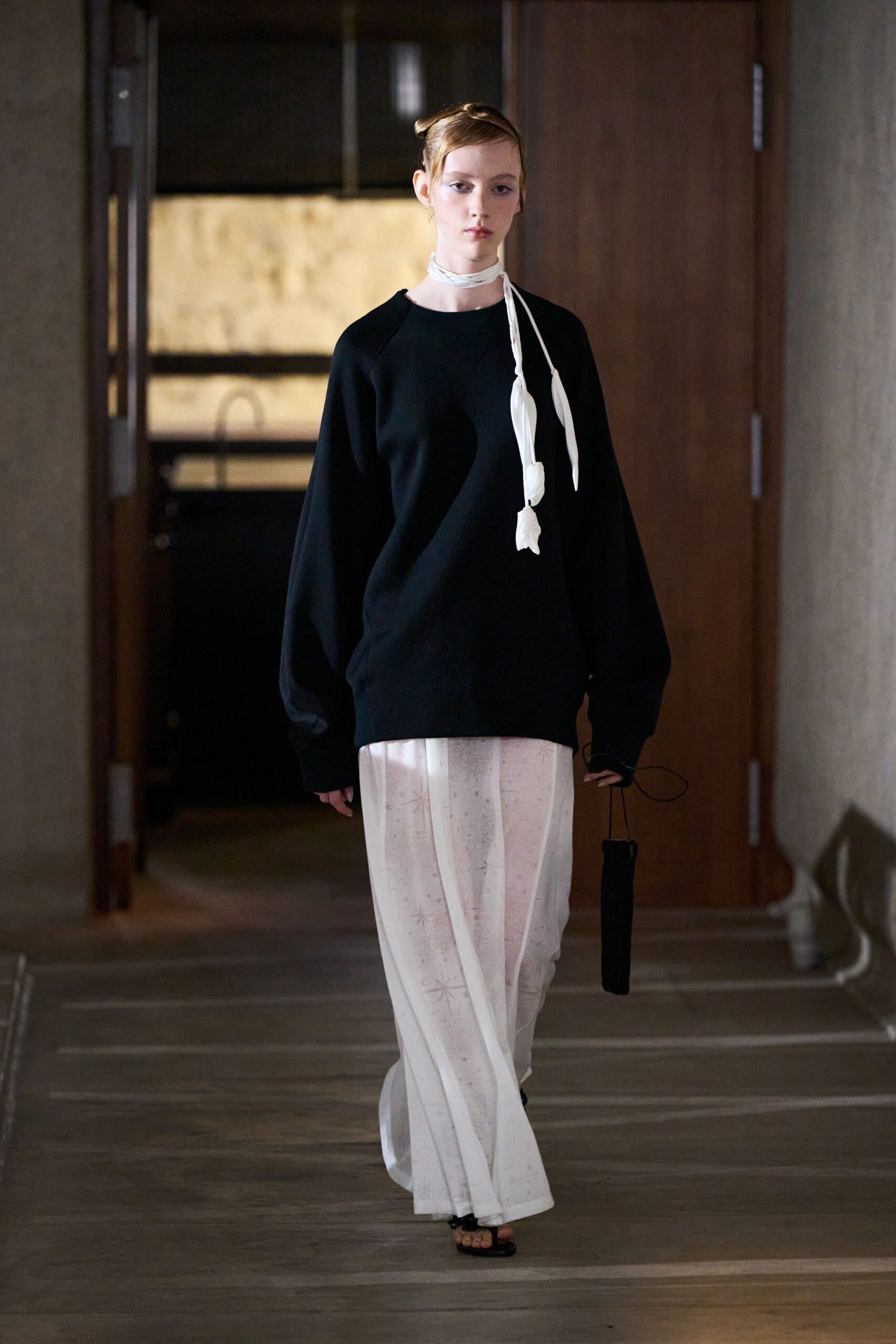 black oversized sweater white wide-leg pants