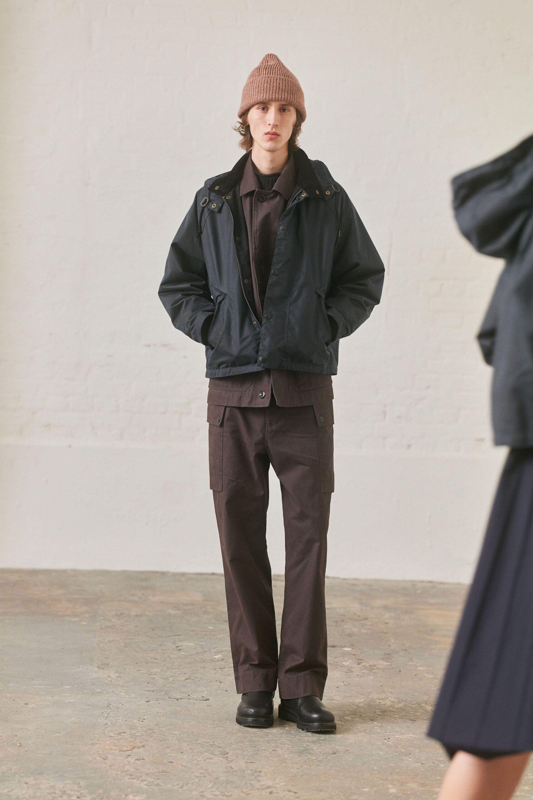 black jacket brown shirt cargo pants