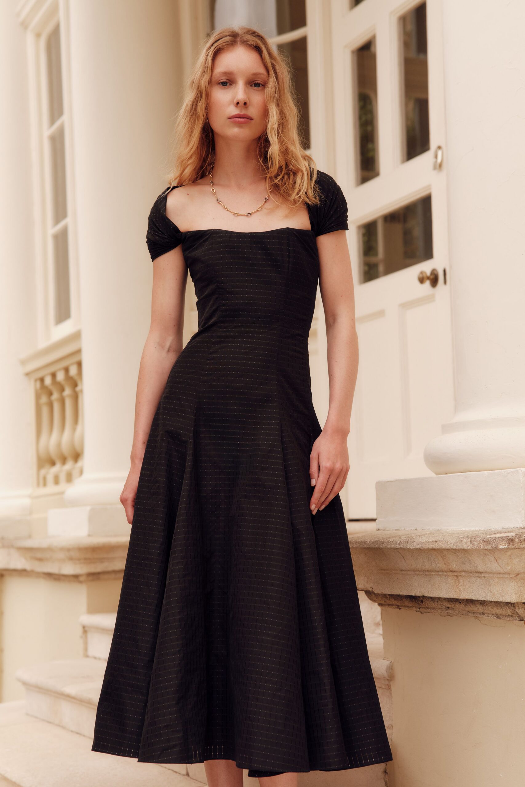 black fitted midi dress