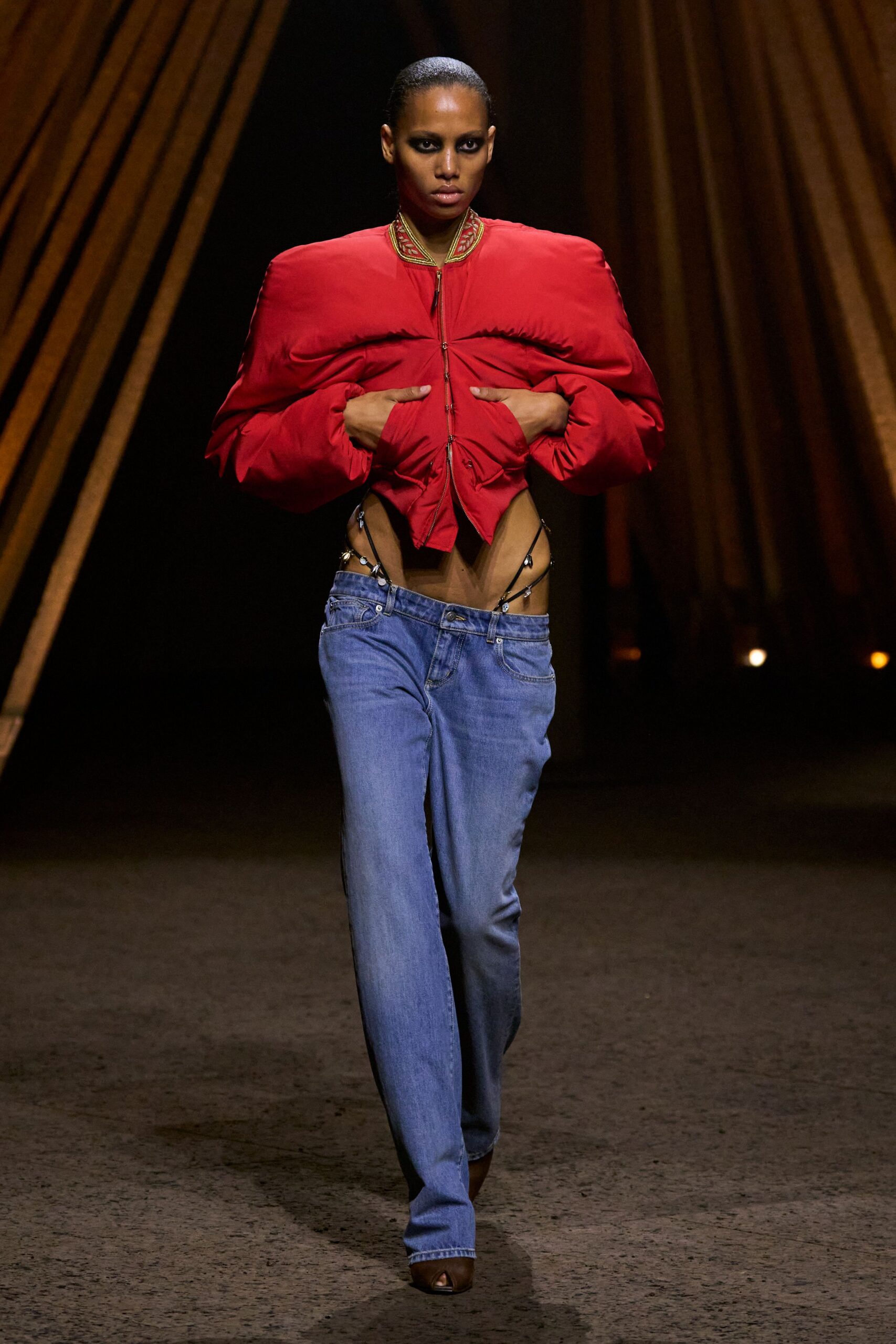 red fitted jacket with blue jeans